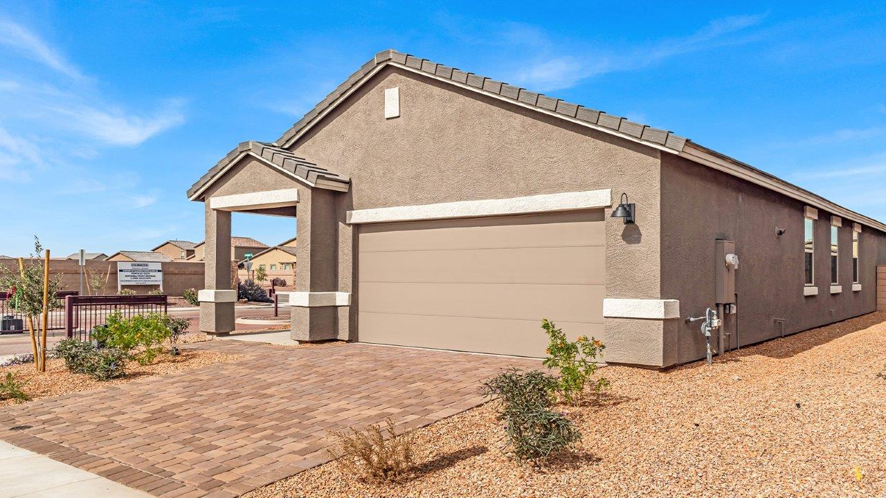 Discover new homes within the only gated community in Gladden Farms. Coronet at Gladden Farms, a premier D.R. Horton community where modern living meets the scenic charm of Marana, Arizona. Coronet offers residents the perfect blend of small-town warmth and modern amenities. Surrounded by 830 acres of green space, 28 parks, and 19 playgrounds, this gated community is designed for families who value both comfort and outdoor adventure.  Residents of Coronet at Gladden Farms enjoy exclusive amenities such as a sparkling community pool, jacuzzi, fitness center, and a clubhouse complete with a BBQ area and patio. The community also offers walking trails, a dog park, and playgrounds, making it the ideal environment for families and active lifestyles. Each home is thoughtfully designed with high-end finishes, including quartz countertops, wood-look luxury vinyl plank flooring, tile roofs, Spanish Lace stucco exteriors and beautifully landscaped front yards with auto drip irrigation. Additionally, all homes feature covered front porches and back patios, perfect for enjoying the stunning Arizona sunsets and monsoons.  Coronet at Gladden Farms is built with a commitment to energy efficiency and sustainability. Each home meets the DOE Zero Energy Ready Home standards, meaning they are constructed to be so energy-efficient that a renewable energy system could offset most or all of the home's annual energy use. These homes include advanced features such as tankless water heaters, energy-efficient LED lighting, and high-performance insulation, ensuring lower utility costs and a reduced environmental footprint. The Home is Connected Smart Home package, which includes a smart thermostat, video doorbell, keyless entry, a Wi-Fi-enabled garage door opener, and much more, provides modern convenience and enhanced security.  Living in Coronet at Gladden Farms means being part of a thriving community with easy access to shopping, dining, and recreation. The greater Gladden Farms area is equipped with amenities like a splashpad, soccer fields, and the Paws & Claws Dog Park. Families will appreciate being part of the Marana Unified School District, with Gladden Farms Elementary nearby and a new K-8 school opening in 2025.  Beyond the community, residents can explore the natural beauty of the area with proximity to Picacho Peak State Park, Tortolita Mountain Park, and Saguaro National Park, offering endless opportunities for hiking, cycling, and wildlife viewing. Experience the perfect blend of comfort, convenience, and community at Coronet at Gladden Farms—where new homes, energy efficiency, and a vibrant lifestyle await.