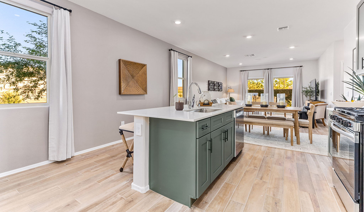 Discover new homes within the only gated community in Gladden Farms. Coronet at Gladden Farms, a premier D.R. Horton community where modern living meets the scenic charm of Marana, Arizona. Coronet offers residents the perfect blend of small-town warmth and modern amenities. Surrounded by 830 acres of green space, 28 parks, and 19 playgrounds, this gated community is designed for families who value both comfort and outdoor adventure.  Residents of Coronet at Gladden Farms enjoy exclusive amenities such as a sparkling community pool, jacuzzi, fitness center, and a clubhouse complete with a BBQ area and patio. The community also offers walking trails, a dog park, and playgrounds, making it the ideal environment for families and active lifestyles. Each home is thoughtfully designed with high-end finishes, including quartz countertops, wood-look luxury vinyl plank flooring, tile roofs, Spanish Lace stucco exteriors and beautifully landscaped front yards with auto drip irrigation. Additionally, all homes feature covered front porches and back patios, perfect for enjoying the stunning Arizona sunsets and monsoons.  Coronet at Gladden Farms is built with a commitment to energy efficiency and sustainability. Each home meets the DOE Zero Energy Ready Home standards, meaning they are constructed to be so energy-efficient that a renewable energy system could offset most or all of the home's annual energy use. These homes include advanced features such as tankless water heaters, energy-efficient LED lighting, and high-performance insulation, ensuring lower utility costs and a reduced environmental footprint. The Home is Connected Smart Home package, which includes a smart thermostat, video doorbell, keyless entry, a Wi-Fi-enabled garage door opener, and much more, provides modern convenience and enhanced security.  Living in Coronet at Gladden Farms means being part of a thriving community with easy access to shopping, dining, and recreation. The greater Gladden Farms area is equipped with amenities like a splashpad, soccer fields, and the Paws & Claws Dog Park. Families will appreciate being part of the Marana Unified School District, with Gladden Farms Elementary nearby and a new K-8 school opening in 2025.  Beyond the community, residents can explore the natural beauty of the area with proximity to Picacho Peak State Park, Tortolita Mountain Park, and Saguaro National Park, offering endless opportunities for hiking, cycling, and wildlife viewing. Experience the perfect blend of comfort, convenience, and community at Coronet at Gladden Farms—where new homes, energy efficiency, and a vibrant lifestyle await.