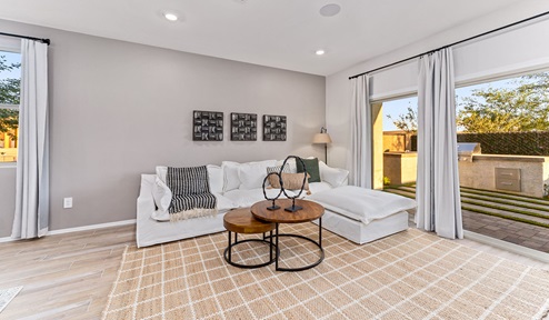 Discover new homes within the only gated community in Gladden Farms. Coronet at Gladden Farms, a premier D.R. Horton community where modern living meets the scenic charm of Marana, Arizona. Coronet offers residents the perfect blend of small-town warmth and modern amenities. Surrounded by 830 acres of green space, 28 parks, and 19 playgrounds, this gated community is designed for families who value both comfort and outdoor adventure. Residents of Coronet at Gladden Farms enjoy exclusive amenities such as a sparkling community pool, jacuzzi, fitness center, and a clubhouse complete with a BBQ area and patio. The community also offers walking trails, a dog park, and playgrounds, making it the ideal environment for families and active lifestyles. Each home is thoughtfully designed with high-end finishes, including quartz countertops, wood-look luxury vinyl plank flooring, tile roofs, Spanish Lace stucco exteriors and beautifully landscaped front yards with auto drip irrigation. Additionally, all homes feature covered front porches and back patios, perfect for enjoying the stunning Arizona sunsets and monsoons. Coronet at Gladden Farms is built with a commitment to energy efficiency and sustainability. Each home meets the DOE Zero Energy Ready Home standards, meaning they are constructed to be so energy-efficient that a renewable energy system could offset most or all of the home's annual energy use. These homes include advanced features such as tankless water heaters, energy-efficient LED lighting, and high-performance insulation, ensuring lower utility costs and a reduced environmental footprint. The Home is Connected Smart Home package, which includes a smart thermostat, video doorbell, keyless entry, a Wi-Fi-enabled garage door opener, and much more, provides modern convenience and enhanced security. Living in Coronet at Gladden Farms means being part of a thriving community with easy access to shopping, dining, and recreation. The greater Gladden Farms area is equipped with amenities like a splashpad, soccer fields, and the Paws & Claws Dog Park. Families will appreciate being part of the Marana Unified School District, with Gladden Farms Elementary nearby and a new K-8 school opening in 2025. Beyond the community, residents can explore the natural beauty of the area with proximity to Picacho Peak State Park, Tortolita Mountain Park, and Saguaro National Park, offering endless opportunities for hiking, cycling, and wildlife viewing. Experience the perfect blend of comfort, convenience, and community at Coronet at Gladden Farms—where new homes, energy efficiency, and a vibrant lifestyle await.