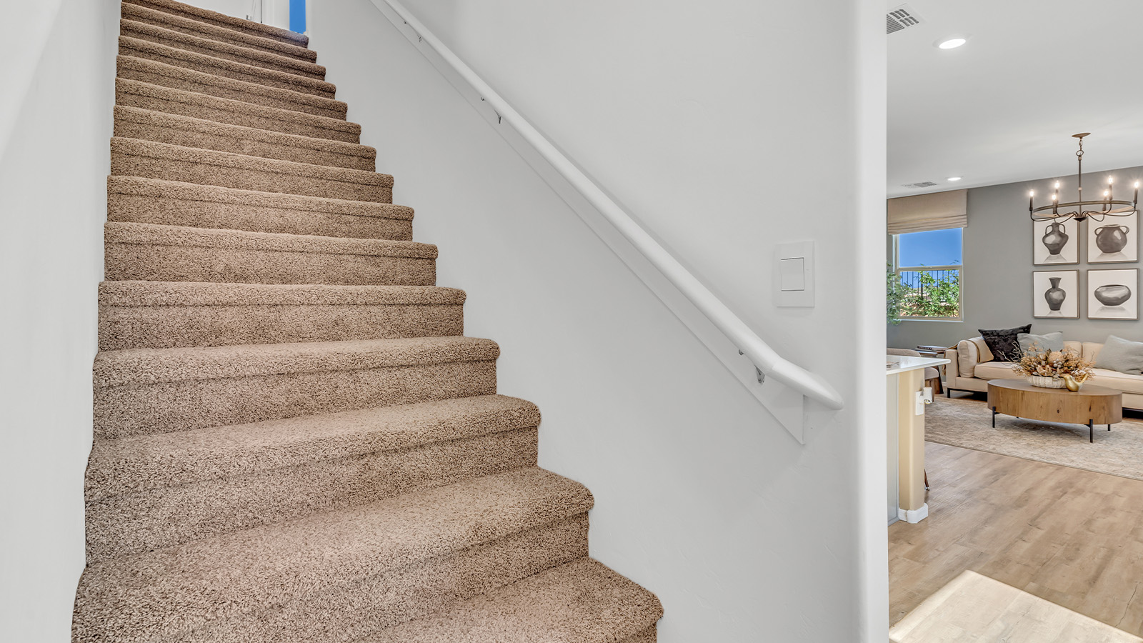 Discover new homes within the only gated community in Gladden Farms. Coronet at Gladden Farms, a premier D.R. Horton community where modern living meets the scenic charm of Marana, Arizona. Coronet offers residents the perfect blend of small-town warmth and modern amenities. Surrounded by 830 acres of green space, 28 parks, and 19 playgrounds, this gated community is designed for families who value both comfort and outdoor adventure.  Residents of Coronet at Gladden Farms enjoy exclusive amenities such as a sparkling community pool, jacuzzi, fitness center, and a clubhouse complete with a BBQ area and patio. The community also offers walking trails, a dog park, and playgrounds, making it the ideal environment for families and active lifestyles. Each home is thoughtfully designed with high-end finishes, including quartz countertops, wood-look luxury vinyl plank flooring, tile roofs, Spanish Lace stucco exteriors and beautifully landscaped front yards with auto drip irrigation. Additionally, all homes feature covered front porches and back patios, perfect for enjoying the stunning Arizona sunsets and monsoons.  Coronet at Gladden Farms is built with a commitment to energy efficiency and sustainability. Each home meets the DOE Zero Energy Ready Home standards, meaning they are constructed to be so energy-efficient that a renewable energy system could offset most or all of the home's annual energy use. These homes include advanced features such as tankless water heaters, energy-efficient LED lighting, and high-performance insulation, ensuring lower utility costs and a reduced environmental footprint. The Home is Connected Smart Home package, which includes a smart thermostat, video doorbell, keyless entry, a Wi-Fi-enabled garage door opener, and much more, provides modern convenience and enhanced security.  Living in Coronet at Gladden Farms means being part of a thriving community with easy access to shopping, dining, and recreation. The greater Gladden Farms area is equipped with amenities like a splashpad, soccer fields, and the Paws & Claws Dog Park. Families will appreciate being part of the Marana Unified School District, with Gladden Farms Elementary nearby and a new K-8 school opening in 2025.  Beyond the community, residents can explore the natural beauty of the area with proximity to Picacho Peak State Park, Tortolita Mountain Park, and Saguaro National Park, offering endless opportunities for hiking, cycling, and wildlife viewing. Experience the perfect blend of comfort, convenience, and community at Coronet at Gladden Farms—where new homes, energy efficiency, and a vibrant lifestyle await.