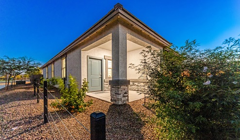 Discover new homes within the only gated community in Gladden Farms. Coronet at Gladden Farms, a premier D.R. Horton community where modern living meets the scenic charm of Marana, Arizona. Coronet offers residents the perfect blend of small-town warmth and modern amenities. Surrounded by 830 acres of green space, 28 parks, and 19 playgrounds, this gated community is designed for families who value both comfort and outdoor adventure. Residents of Coronet at Gladden Farms enjoy exclusive amenities such as a sparkling community pool, jacuzzi, fitness center, and a clubhouse complete with a BBQ area and patio. The community also offers walking trails, a dog park, and playgrounds, making it the ideal environment for families and active lifestyles. Each home is thoughtfully designed with high-end finishes, including quartz countertops, wood-look luxury vinyl plank flooring, tile roofs, Spanish Lace stucco exteriors and beautifully landscaped front yards with auto drip irrigation. Additionally, all homes feature covered front porches and back patios, perfect for enjoying the stunning Arizona sunsets and monsoons. Coronet at Gladden Farms is built with a commitment to energy efficiency and sustainability. Each home meets the DOE Zero Energy Ready Home standards, meaning they are constructed to be so energy-efficient that a renewable energy system could offset most or all of the home's annual energy use. These homes include advanced features such as tankless water heaters, energy-efficient LED lighting, and high-performance insulation, ensuring lower utility costs and a reduced environmental footprint. The Home is Connected Smart Home package, which includes a smart thermostat, video doorbell, keyless entry, a Wi-Fi-enabled garage door opener, and much more, provides modern convenience and enhanced security. Living in Coronet at Gladden Farms means being part of a thriving community with easy access to shopping, dining, and recreation. The greater Gladden Farms area is equipped with amenities like a splashpad, soccer fields, and the Paws & Claws Dog Park. Families will appreciate being part of the Marana Unified School District, with Gladden Farms Elementary nearby and a new K-8 school opening in 2025. Beyond the community, residents can explore the natural beauty of the area with proximity to Picacho Peak State Park, Tortolita Mountain Park, and Saguaro National Park, offering endless opportunities for hiking, cycling, and wildlife viewing. Experience the perfect blend of comfort, convenience, and community at Coronet at Gladden Farms—where new homes, energy efficiency, and a vibrant lifestyle await.