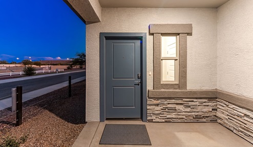 Discover new homes within the only gated community in Gladden Farms. Coronet at Gladden Farms, a premier D.R. Horton community where modern living meets the scenic charm of Marana, Arizona. Coronet offers residents the perfect blend of small-town warmth and modern amenities. Surrounded by 830 acres of green space, 28 parks, and 19 playgrounds, this gated community is designed for families who value both comfort and outdoor adventure. Residents of Coronet at Gladden Farms enjoy exclusive amenities such as a sparkling community pool, jacuzzi, fitness center, and a clubhouse complete with a BBQ area and patio. The community also offers walking trails, a dog park, and playgrounds, making it the ideal environment for families and active lifestyles. Each home is thoughtfully designed with high-end finishes, including quartz countertops, wood-look luxury vinyl plank flooring, tile roofs, Spanish Lace stucco exteriors and beautifully landscaped front yards with auto drip irrigation. Additionally, all homes feature covered front porches and back patios, perfect for enjoying the stunning Arizona sunsets and monsoons. Coronet at Gladden Farms is built with a commitment to energy efficiency and sustainability. Each home meets the DOE Zero Energy Ready Home standards, meaning they are constructed to be so energy-efficient that a renewable energy system could offset most or all of the home's annual energy use. These homes include advanced features such as tankless water heaters, energy-efficient LED lighting, and high-performance insulation, ensuring lower utility costs and a reduced environmental footprint. The Home is Connected Smart Home package, which includes a smart thermostat, video doorbell, keyless entry, a Wi-Fi-enabled garage door opener, and much more, provides modern convenience and enhanced security. Living in Coronet at Gladden Farms means being part of a thriving community with easy access to shopping, dining, and recreation. The greater Gladden Farms area is equipped with amenities like a splashpad, soccer fields, and the Paws & Claws Dog Park. Families will appreciate being part of the Marana Unified School District, with Gladden Farms Elementary nearby and a new K-8 school opening in 2025. Beyond the community, residents can explore the natural beauty of the area with proximity to Picacho Peak State Park, Tortolita Mountain Park, and Saguaro National Park, offering endless opportunities for hiking, cycling, and wildlife viewing. Experience the perfect blend of comfort, convenience, and community at Coronet at Gladden Farms—where new homes, energy efficiency, and a vibrant lifestyle await.