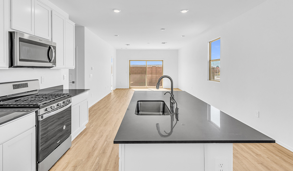 Welcome to The Amber at Coronet at Gladden Farms in Marana, Arizona – a thoughtfully designed 1,330 sq. ft. single-story new home that perfectly combines modern convenience with the natural beauty of the surrounding landscape.  As you step through the inviting front porch, you’re greeted by a smartly arranged entryway that opens into the heart of the home. The great room serves as the central gathering place, seamlessly connecting to the dining area and kitchen, creating an open and inviting space that’s perfect for both everyday living and entertaining.  The kitchen, designed with both style and functionality in mind, features quartz countertops, modern appliances, and a pantry that provides ample storage. The adjacent dining area offers a comfortable setting for meals, while the open layout ensures that the kitchen, dining, and living spaces are always connected.  At the rear of the home, the primary suite offers a peaceful retreat. The spacious bedroom leads to a well-appointed en-suite bathroom, complete with dual vanities, a walk-in shower, and a large walk-in closet, providing both comfort and convenience.  The Amber also includes two additional bedrooms, each offering plenty of space and natural light. These rooms are conveniently located near a second full bathroom, making them ideal for family members or guests.  Additional features of the home include a utility room and direct access to a two-car garage, adding practicality to the overall design. Step outside to the covered patio, where you can enjoy the stunning Arizona sunsets and the tranquil surroundings of Coronet at Gladden Farms.  Built with energy efficiency in mind, The Amber at Coronet at Gladden Farms is a DOE Zero Energy Ready Home, offering a sustainable lifestyle with lower utility costs and a reduced environmental footprint.  *Images shown are for reference only. They depict the home specifications and may not represent the actual home or design package.