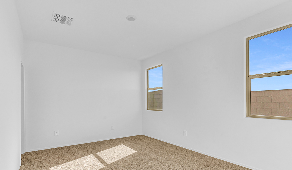 Welcome to The Amber at Coronet at Gladden Farms in Marana, Arizona – a thoughtfully designed 1,330 sq. ft. single-story new home that perfectly combines modern convenience with the natural beauty of the surrounding landscape.  As you step through the inviting front porch, you’re greeted by a smartly arranged entryway that opens into the heart of the home. The great room serves as the central gathering place, seamlessly connecting to the dining area and kitchen, creating an open and inviting space that’s perfect for both everyday living and entertaining.  The kitchen, designed with both style and functionality in mind, features quartz countertops, modern appliances, and a pantry that provides ample storage. The adjacent dining area offers a comfortable setting for meals, while the open layout ensures that the kitchen, dining, and living spaces are always connected.  At the rear of the home, the primary suite offers a peaceful retreat. The spacious bedroom leads to a well-appointed en-suite bathroom, complete with dual vanities, a walk-in shower, and a large walk-in closet, providing both comfort and convenience.  The Amber also includes two additional bedrooms, each offering plenty of space and natural light. These rooms are conveniently located near a second full bathroom, making them ideal for family members or guests.  Additional features of the home include a utility room and direct access to a two-car garage, adding practicality to the overall design. Step outside to the covered patio, where you can enjoy the stunning Arizona sunsets and the tranquil surroundings of Coronet at Gladden Farms.  Built with energy efficiency in mind, The Amber at Coronet at Gladden Farms is a DOE Zero Energy Ready Home, offering a sustainable lifestyle with lower utility costs and a reduced environmental footprint.  *Images shown are for reference only. They depict the home specifications and may not represent the actual home or design package.