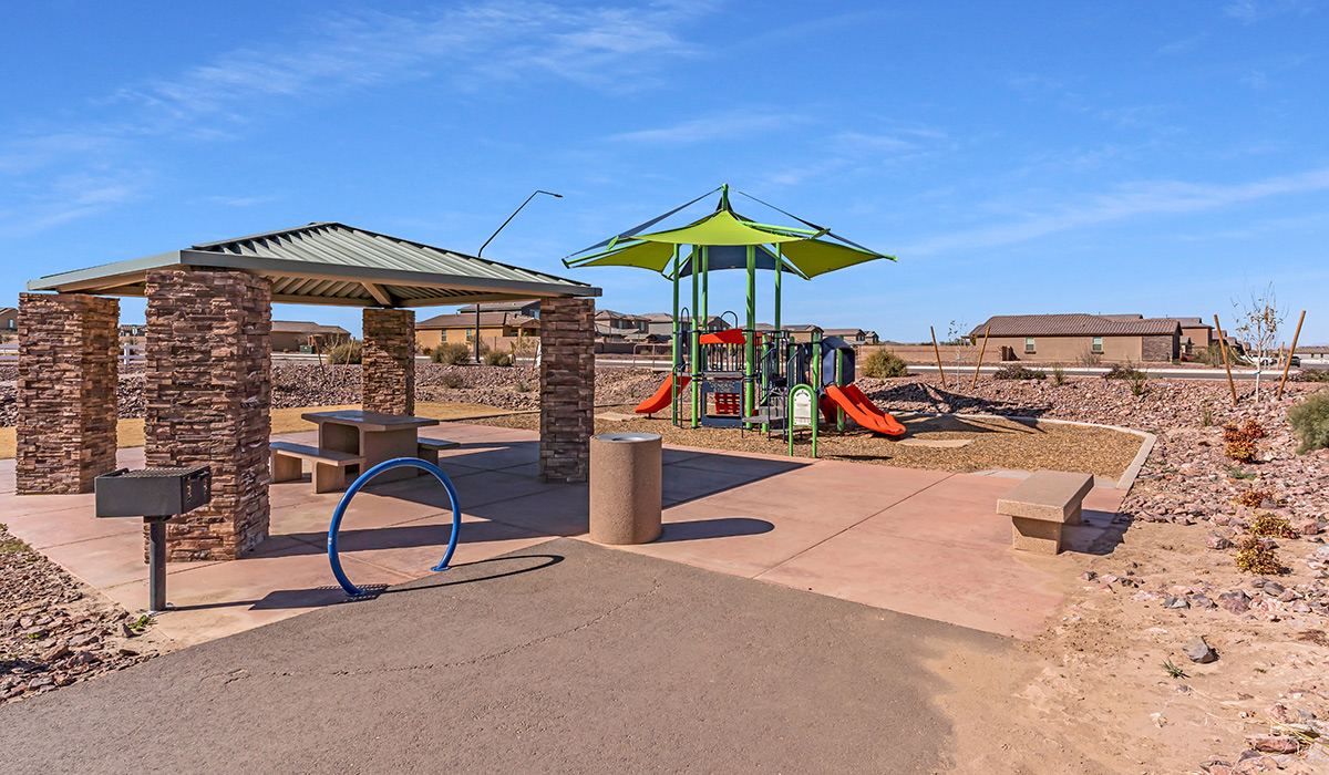 Welcome to The Amber at Coronet at Gladden Farms in Marana, Arizona – a thoughtfully designed 1,330 sq. ft. single-story new home that perfectly combines modern convenience with the natural beauty of the surrounding landscape.  As you step through the inviting front porch, you’re greeted by a smartly arranged entryway that opens into the heart of the home. The great room serves as the central gathering place, seamlessly connecting to the dining area and kitchen, creating an open and inviting space that’s perfect for both everyday living and entertaining.  The kitchen, designed with both style and functionality in mind, features quartz countertops, modern appliances, and a pantry that provides ample storage. The adjacent dining area offers a comfortable setting for meals, while the open layout ensures that the kitchen, dining, and living spaces are always connected.  At the rear of the home, the primary suite offers a peaceful retreat. The spacious bedroom leads to a well-appointed en-suite bathroom, complete with dual vanities, a walk-in shower, and a large walk-in closet, providing both comfort and convenience.  The Amber also includes two additional bedrooms, each offering plenty of space and natural light. These rooms are conveniently located near a second full bathroom, making them ideal for family members or guests.  Additional features of the home include a utility room and direct access to a two-car garage, adding practicality to the overall design. Step outside to the covered patio, where you can enjoy the stunning Arizona sunsets and the tranquil surroundings of Coronet at Gladden Farms.  Built with energy efficiency in mind, The Amber at Coronet at Gladden Farms is a DOE Zero Energy Ready Home, offering a sustainable lifestyle with lower utility costs and a reduced environmental footprint.  *Images shown are for reference only. They depict the home specifications and may not represent the actual home or design package.