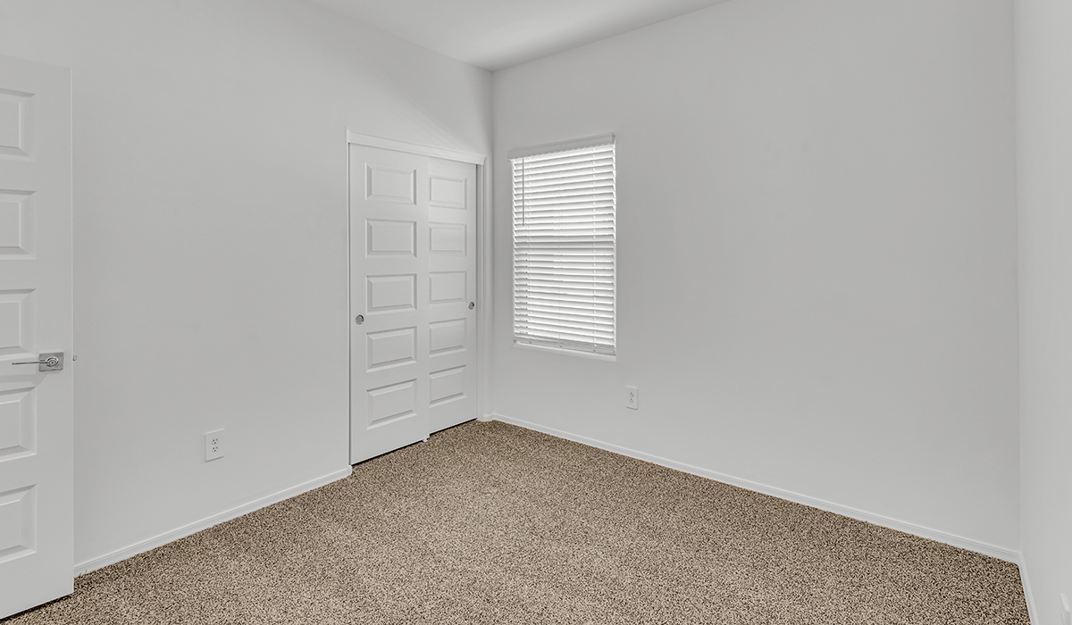 Welcome to The Amber at Coronet at Gladden Farms in Marana, Arizona – a thoughtfully designed 1,330 sq. ft. single-story new home that perfectly combines modern convenience with the natural beauty of the surrounding landscape.  As you step through the inviting front porch, you’re greeted by a smartly arranged entryway that opens into the heart of the home. The great room serves as the central gathering place, seamlessly connecting to the dining area and kitchen, creating an open and inviting space that’s perfect for both everyday living and entertaining.  The kitchen, designed with both style and functionality in mind, features quartz countertops, modern appliances, and a pantry that provides ample storage. The adjacent dining area offers a comfortable setting for meals, while the open layout ensures that the kitchen, dining, and living spaces are always connected.  At the rear of the home, the primary suite offers a peaceful retreat. The spacious bedroom leads to a well-appointed en-suite bathroom, complete with dual vanities, a walk-in shower, and a large walk-in closet, providing both comfort and convenience.  The Amber also includes two additional bedrooms, each offering plenty of space and natural light. These rooms are conveniently located near a second full bathroom, making them ideal for family members or guests.  Additional features of the home include a utility room and direct access to a two-car garage, adding practicality to the overall design. Step outside to the covered patio, where you can enjoy the stunning Arizona sunsets and the tranquil surroundings of Coronet at Gladden Farms.  Built with energy efficiency in mind, The Amber at Coronet at Gladden Farms is a DOE Zero Energy Ready Home, offering a sustainable lifestyle with lower utility costs and a reduced environmental footprint.