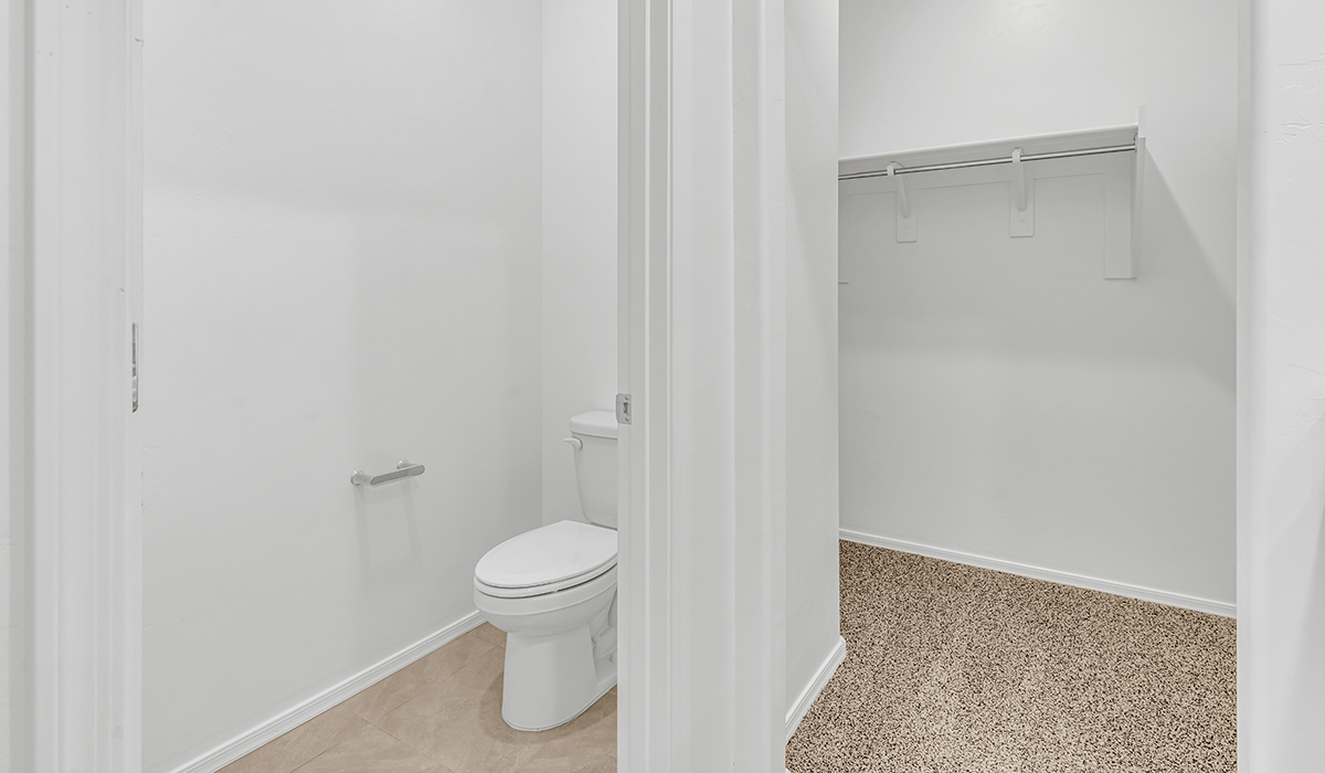 Welcome to The Amber at Coronet at Gladden Farms in Marana, Arizona – a thoughtfully designed 1,330 sq. ft. single-story new home that perfectly combines modern convenience with the natural beauty of the surrounding landscape.  As you step through the inviting front porch, you’re greeted by a smartly arranged entryway that opens into the heart of the home. The great room serves as the central gathering place, seamlessly connecting to the dining area and kitchen, creating an open and inviting space that’s perfect for both everyday living and entertaining.  The kitchen, designed with both style and functionality in mind, features quartz countertops, modern appliances, and a pantry that provides ample storage. The adjacent dining area offers a comfortable setting for meals, while the open layout ensures that the kitchen, dining, and living spaces are always connected.  At the rear of the home, the primary suite offers a peaceful retreat. The spacious bedroom leads to a well-appointed en-suite bathroom, complete with dual vanities, a walk-in shower, and a large walk-in closet, providing both comfort and convenience.  The Amber also includes two additional bedrooms, each offering plenty of space and natural light. These rooms are conveniently located near a second full bathroom, making them ideal for family members or guests.  Additional features of the home include a utility room and direct access to a two-car garage, adding practicality to the overall design. Step outside to the covered patio, where you can enjoy the stunning Arizona sunsets and the tranquil surroundings of Coronet at Gladden Farms.  Built with energy efficiency in mind, The Amber at Coronet at Gladden Farms is a DOE Zero Energy Ready Home, offering a sustainable lifestyle with lower utility costs and a reduced environmental footprint.