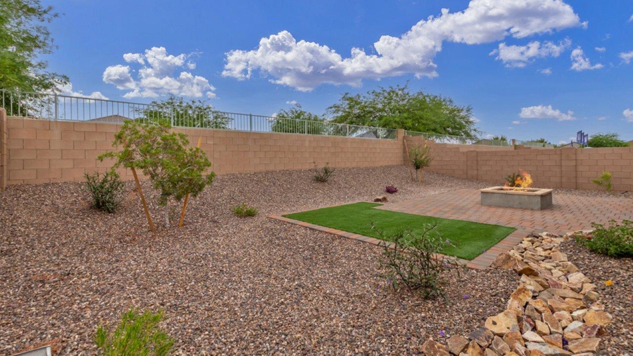 Welcome to The Amber at Coronet at Gladden Farms in Marana, Arizona – a thoughtfully designed 1,330 sq. ft. single-story new home that perfectly combines modern convenience with the natural beauty of the surrounding landscape.  As you step through the inviting front porch, you’re greeted by a smartly arranged entryway that opens into the heart of the home. The great room serves as the central gathering place, seamlessly connecting to the dining area and kitchen, creating an open and inviting space that’s perfect for both everyday living and entertaining.  The kitchen, designed with both style and functionality in mind, features quartz countertops, modern appliances, and a pantry that provides ample storage. The adjacent dining area offers a comfortable setting for meals, while the open layout ensures that the kitchen, dining, and living spaces are always connected.  At the rear of the home, the master suite offers a peaceful retreat. The spacious bedroom leads to a well-appointed en-suite bathroom, complete with dual vanities, a walk-in shower, and a large walk-in closet, providing both comfort and convenience.  The Amber also includes two additional bedrooms, each offering plenty of space and natural light. These rooms are conveniently located near a second full bathroom, making them ideal for family members or guests.  Additional features of the home include a utility room and direct access to a two-car garage, adding practicality to the overall design. Step outside to the covered patio, where you can enjoy the stunning Arizona sunsets and the tranquil surroundings of Coronet at Gladden Farms.  Built with energy efficiency in mind, The Amber at Coronet at Gladden Farms is a DOE Zero Energy Ready Home, offering a sustainable lifestyle with lower utility costs and a reduced environmental footprint.