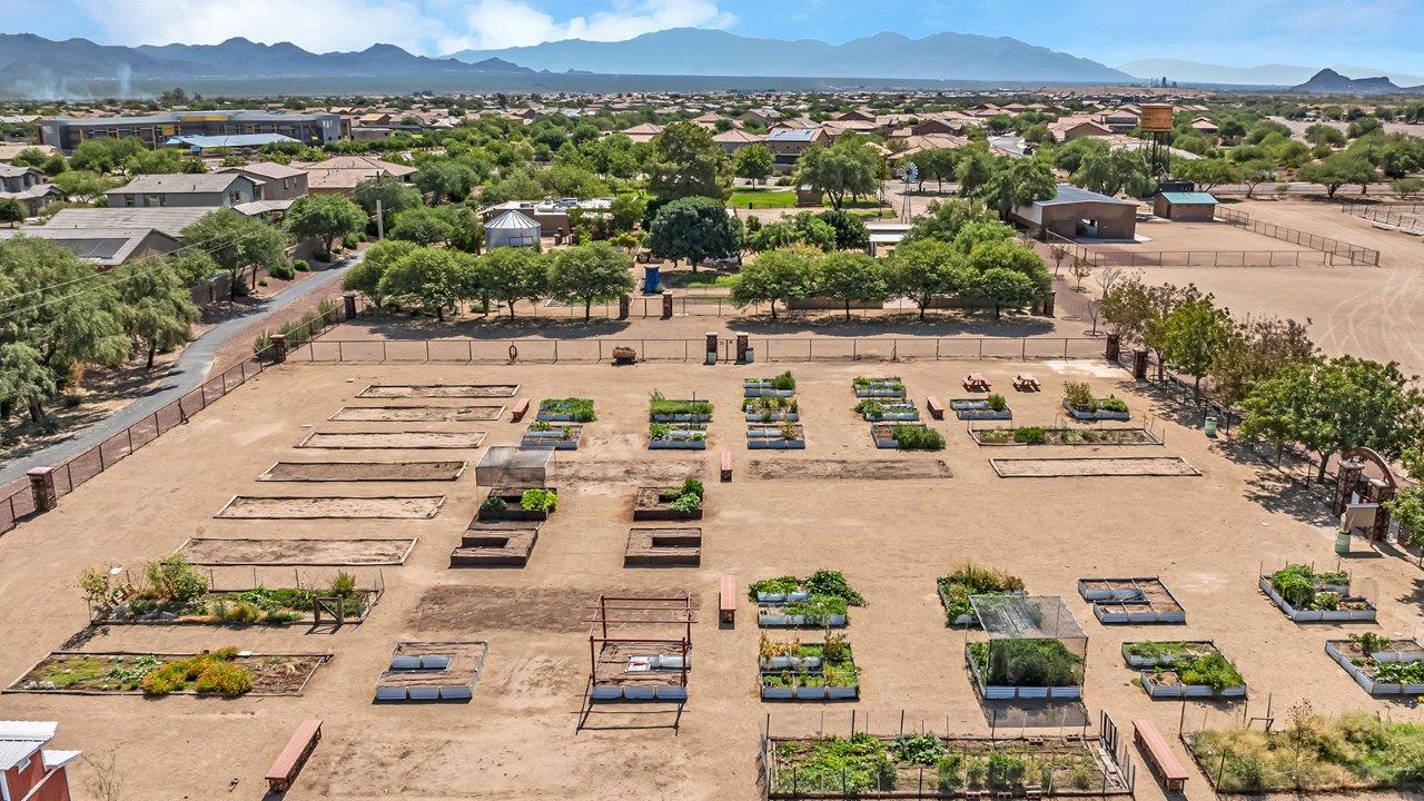 Welcome to The Amber at Coronet at Gladden Farms in Marana, Arizona – a thoughtfully designed 1,330 sq. ft. single-story new home that perfectly combines modern convenience with the natural beauty of the surrounding landscape.  As you step through the inviting front porch, you’re greeted by a smartly arranged entryway that opens into the heart of the home. The great room serves as the central gathering place, seamlessly connecting to the dining area and kitchen, creating an open and inviting space that’s perfect for both everyday living and entertaining.  The kitchen, designed with both style and functionality in mind, features quartz countertops, modern appliances, and a pantry that provides ample storage. The adjacent dining area offers a comfortable setting for meals, while the open layout ensures that the kitchen, dining, and living spaces are always connected.  At the rear of the home, the master suite offers a peaceful retreat. The spacious bedroom leads to a well-appointed en-suite bathroom, complete with dual vanities, a walk-in shower, and a large walk-in closet, providing both comfort and convenience.  The Amber also includes two additional bedrooms, each offering plenty of space and natural light. These rooms are conveniently located near a second full bathroom, making them ideal for family members or guests.  Additional features of the home include a utility room and direct access to a two-car garage, adding practicality to the overall design. Step outside to the covered patio, where you can enjoy the stunning Arizona sunsets and the tranquil surroundings of Coronet at Gladden Farms.  Built with energy efficiency in mind, The Amber at Coronet at Gladden Farms is a DOE Zero Energy Ready Home, offering a sustainable lifestyle with lower utility costs and a reduced environmental footprint.