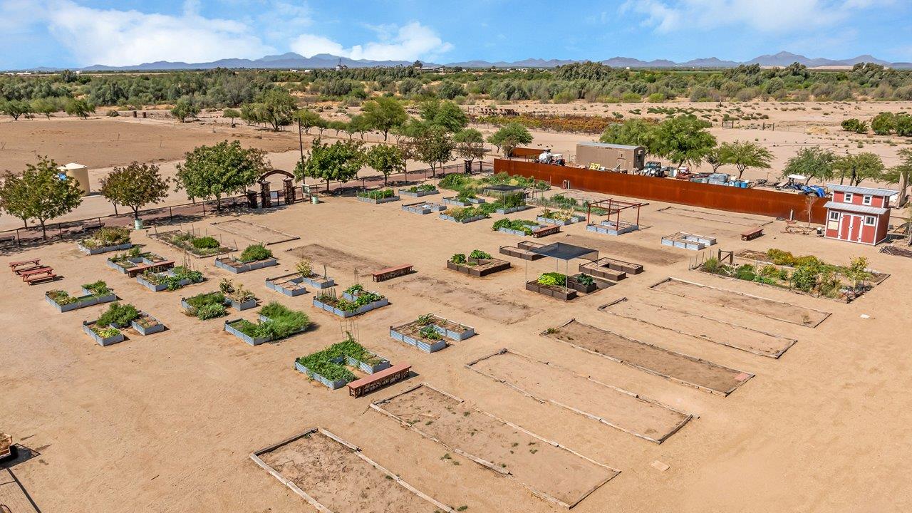 Welcome to The Amber at Coronet at Gladden Farms in Marana, Arizona – a thoughtfully designed 1,330 sq. ft. single-story new home that perfectly combines modern convenience with the natural beauty of the surrounding landscape.  As you step through the inviting front porch, you’re greeted by a smartly arranged entryway that opens into the heart of the home. The great room serves as the central gathering place, seamlessly connecting to the dining area and kitchen, creating an open and inviting space that’s perfect for both everyday living and entertaining.  The kitchen, designed with both style and functionality in mind, features quartz countertops, modern appliances, and a pantry that provides ample storage. The adjacent dining area offers a comfortable setting for meals, while the open layout ensures that the kitchen, dining, and living spaces are always connected.  At the rear of the home, the master suite offers a peaceful retreat. The spacious bedroom leads to a well-appointed en-suite bathroom, complete with dual vanities, a walk-in shower, and a large walk-in closet, providing both comfort and convenience.  The Amber also includes two additional bedrooms, each offering plenty of space and natural light. These rooms are conveniently located near a second full bathroom, making them ideal for family members or guests.  Additional features of the home include a utility room and direct access to a two-car garage, adding practicality to the overall design. Step outside to the covered patio, where you can enjoy the stunning Arizona sunsets and the tranquil surroundings of Coronet at Gladden Farms.  Built with energy efficiency in mind, The Amber at Coronet at Gladden Farms is a DOE Zero Energy Ready Home, offering a sustainable lifestyle with lower utility costs and a reduced environmental footprint.