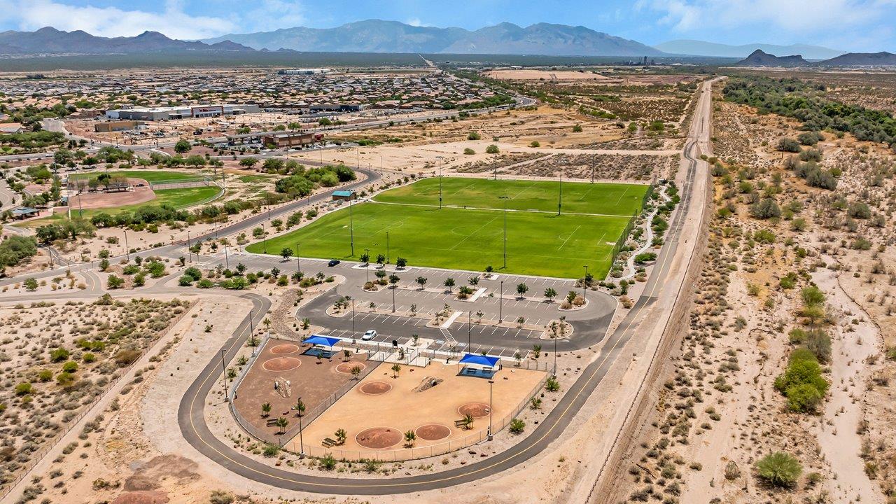 Welcome to The Amber at Coronet at Gladden Farms in Marana, Arizona – a thoughtfully designed 1,330 sq. ft. single-story new home that perfectly combines modern convenience with the natural beauty of the surrounding landscape.  As you step through the inviting front porch, you’re greeted by a smartly arranged entryway that opens into the heart of the home. The great room serves as the central gathering place, seamlessly connecting to the dining area and kitchen, creating an open and inviting space that’s perfect for both everyday living and entertaining.  The kitchen, designed with both style and functionality in mind, features quartz countertops, modern appliances, and a pantry that provides ample storage. The adjacent dining area offers a comfortable setting for meals, while the open layout ensures that the kitchen, dining, and living spaces are always connected.  At the rear of the home, the master suite offers a peaceful retreat. The spacious bedroom leads to a well-appointed en-suite bathroom, complete with dual vanities, a walk-in shower, and a large walk-in closet, providing both comfort and convenience.  The Amber also includes two additional bedrooms, each offering plenty of space and natural light. These rooms are conveniently located near a second full bathroom, making them ideal for family members or guests.  Additional features of the home include a utility room and direct access to a two-car garage, adding practicality to the overall design. Step outside to the covered patio, where you can enjoy the stunning Arizona sunsets and the tranquil surroundings of Coronet at Gladden Farms.  Built with energy efficiency in mind, The Amber at Coronet at Gladden Farms is a DOE Zero Energy Ready Home, offering a sustainable lifestyle with lower utility costs and a reduced environmental footprint.