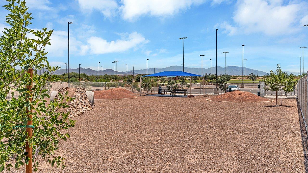 Welcome to The Amber at Coronet at Gladden Farms in Marana, Arizona – a thoughtfully designed 1,330 sq. ft. single-story new home that perfectly combines modern convenience with the natural beauty of the surrounding landscape.  As you step through the inviting front porch, you’re greeted by a smartly arranged entryway that opens into the heart of the home. The great room serves as the central gathering place, seamlessly connecting to the dining area and kitchen, creating an open and inviting space that’s perfect for both everyday living and entertaining.  The kitchen, designed with both style and functionality in mind, features quartz countertops, modern appliances, and a pantry that provides ample storage. The adjacent dining area offers a comfortable setting for meals, while the open layout ensures that the kitchen, dining, and living spaces are always connected.  At the rear of the home, the master suite offers a peaceful retreat. The spacious bedroom leads to a well-appointed en-suite bathroom, complete with dual vanities, a walk-in shower, and a large walk-in closet, providing both comfort and convenience.  The Amber also includes two additional bedrooms, each offering plenty of space and natural light. These rooms are conveniently located near a second full bathroom, making them ideal for family members or guests.  Additional features of the home include a utility room and direct access to a two-car garage, adding practicality to the overall design. Step outside to the covered patio, where you can enjoy the stunning Arizona sunsets and the tranquil surroundings of Coronet at Gladden Farms.  Built with energy efficiency in mind, The Amber at Coronet at Gladden Farms is a DOE Zero Energy Ready Home, offering a sustainable lifestyle with lower utility costs and a reduced environmental footprint.