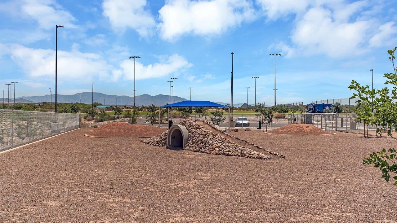 Welcome to The Amber at Coronet at Gladden Farms in Marana, Arizona – a thoughtfully designed 1,330 sq. ft. single-story new home that perfectly combines modern convenience with the natural beauty of the surrounding landscape.  As you step through the inviting front porch, you’re greeted by a smartly arranged entryway that opens into the heart of the home. The great room serves as the central gathering place, seamlessly connecting to the dining area and kitchen, creating an open and inviting space that’s perfect for both everyday living and entertaining.  The kitchen, designed with both style and functionality in mind, features quartz countertops, modern appliances, and a pantry that provides ample storage. The adjacent dining area offers a comfortable setting for meals, while the open layout ensures that the kitchen, dining, and living spaces are always connected.  At the rear of the home, the master suite offers a peaceful retreat. The spacious bedroom leads to a well-appointed en-suite bathroom, complete with dual vanities, a walk-in shower, and a large walk-in closet, providing both comfort and convenience.  The Amber also includes two additional bedrooms, each offering plenty of space and natural light. These rooms are conveniently located near a second full bathroom, making them ideal for family members or guests.  Additional features of the home include a utility room and direct access to a two-car garage, adding practicality to the overall design. Step outside to the covered patio, where you can enjoy the stunning Arizona sunsets and the tranquil surroundings of Coronet at Gladden Farms.  Built with energy efficiency in mind, The Amber at Coronet at Gladden Farms is a DOE Zero Energy Ready Home, offering a sustainable lifestyle with lower utility costs and a reduced environmental footprint.