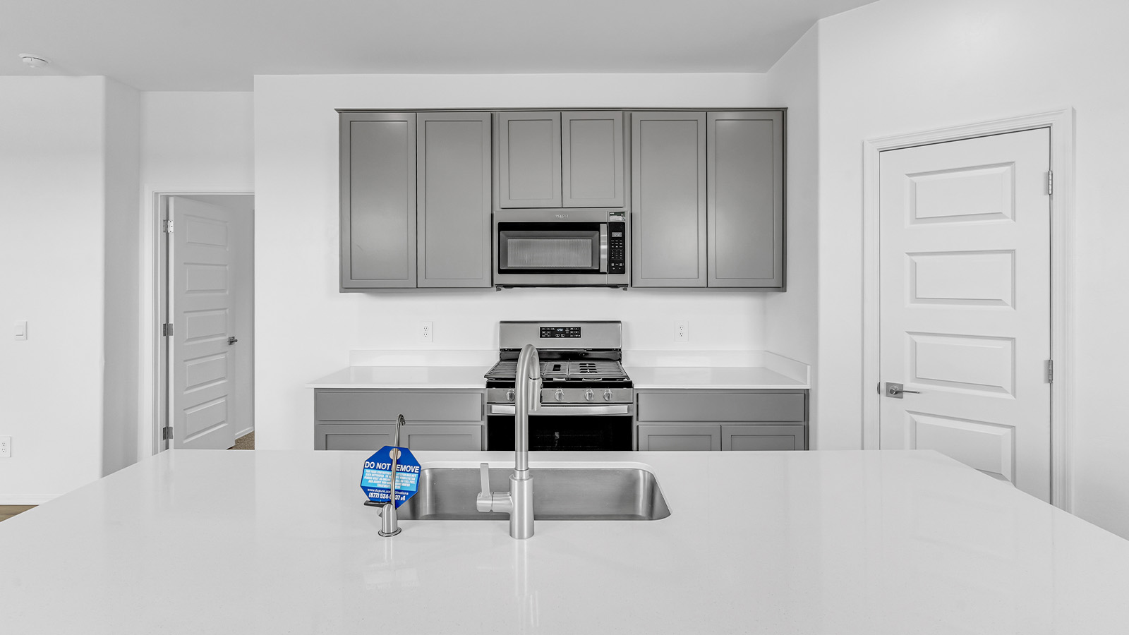 Introducing The Brooke at Coronet at Gladden Farms in Marana, Arizona – a unique 1,654 sq. ft. single-story new home designed for those who seek both comfort and style in a picturesque setting. Exclusively available at Coronet at Gladden Farms, this floorplan offers a one-of-a-kind living experience you won’t find anywhere else.  As you enter through the welcoming front porch, you’ll find yourself in a well-designed entryway that leads into the heart of the home. The great room, with its open and airy layout, is the perfect spot for gathering with family and friends. It flows seamlessly into the dining area and kitchen, creating an inviting space that’s ideal for everything from casual meals to entertaining guests.  The kitchen is the centerpiece of this home, featuring quartz countertops, modern appliances, and a large pantry that provides ample storage. The adjacent dining area offers a comfortable setting for meals, and the open-concept design ensures that the kitchen, dining, and living spaces are always connected.  The Brooke offers a well-thought-out floor plan with four bedrooms, making it perfect for families of all sizes. The master suite, located at the rear of the home, provides a private retreat with a spacious bedroom, a walk-in closet, and an en-suite bathroom complete with dual vanities and a walk-in shower. The additional three bedrooms are thoughtfully positioned near the second full bathroom, ensuring comfort and convenience for all.  A utility room and a two-car garage add practicality to the overall design, while the covered patio extends your living space outdoors. Here, you can enjoy Arizona’s beautiful weather and the stunning views that Coronet at Gladden Farms has to offer.  Designed with energy efficiency in mind, The Brooke at Coronet at Gladden Farms is a DOE Zero Energy Ready Home, providing a sustainable lifestyle with lower utility costs and a reduced environmental footprint.