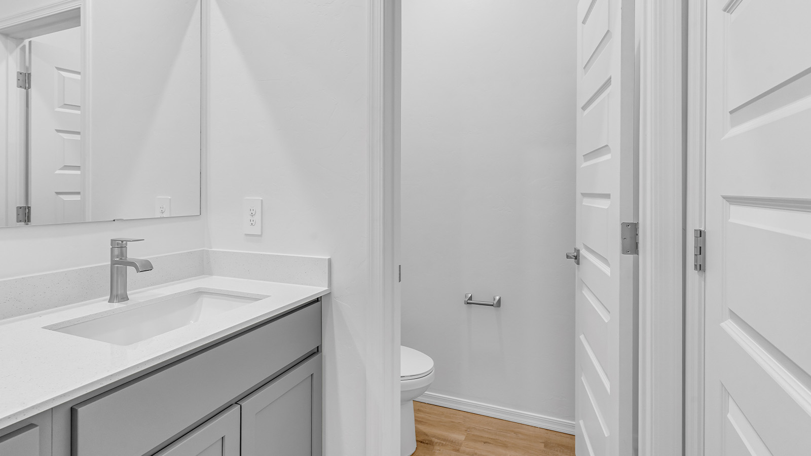 Introducing The Brooke at Coronet at Gladden Farms in Marana, Arizona – a unique 1,654 sq. ft. single-story new home designed for those who seek both comfort and style in a picturesque setting. Exclusively available at Coronet at Gladden Farms, this floorplan offers a one-of-a-kind living experience you won’t find anywhere else.  As you enter through the welcoming front porch, you’ll find yourself in a well-designed entryway that leads into the heart of the home. The great room, with its open and airy layout, is the perfect spot for gathering with family and friends. It flows seamlessly into the dining area and kitchen, creating an inviting space that’s ideal for everything from casual meals to entertaining guests.  The kitchen is the centerpiece of this home, featuring quartz countertops, modern appliances, and a large pantry that provides ample storage. The adjacent dining area offers a comfortable setting for meals, and the open-concept design ensures that the kitchen, dining, and living spaces are always connected.  The Brooke offers a well-thought-out floor plan with four bedrooms, making it perfect for families of all sizes. The master suite, located at the rear of the home, provides a private retreat with a spacious bedroom, a walk-in closet, and an en-suite bathroom complete with dual vanities and a walk-in shower. The additional three bedrooms are thoughtfully positioned near the second full bathroom, ensuring comfort and convenience for all.  A utility room and a two-car garage add practicality to the overall design, while the covered patio extends your living space outdoors. Here, you can enjoy Arizona’s beautiful weather and the stunning views that Coronet at Gladden Farms has to offer.  Designed with energy efficiency in mind, The Brooke at Coronet at Gladden Farms is a DOE Zero Energy Ready Home, providing a sustainable lifestyle with lower utility costs and a reduced environmental footprint.