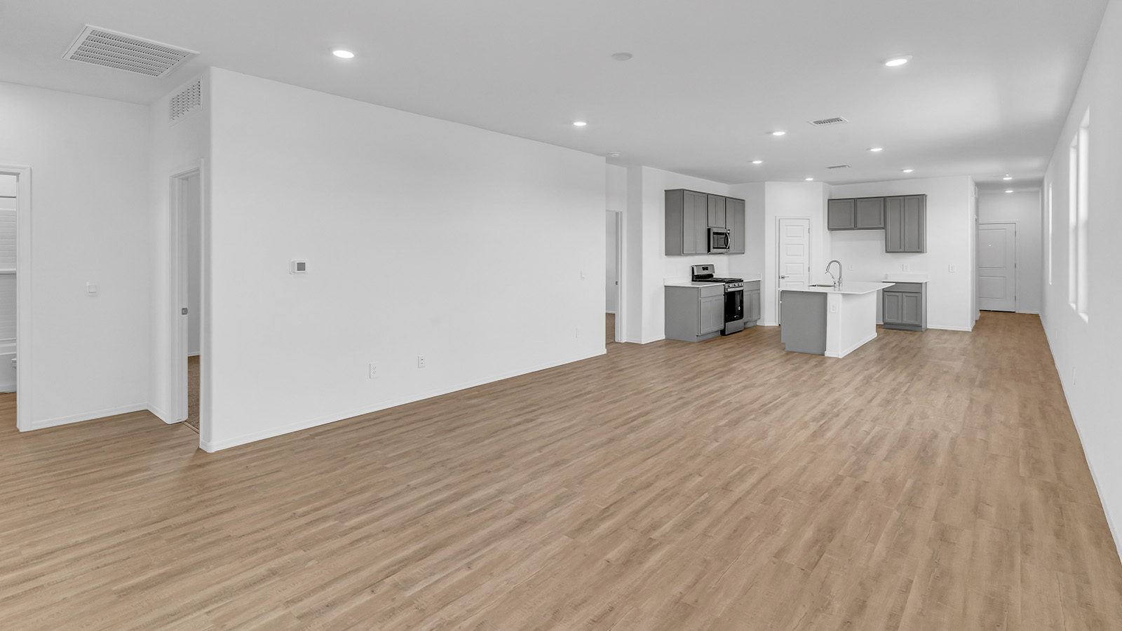 Introducing The Brooke at Coronet at Gladden Farms in Marana, Arizona – a unique 1,654 sq. ft. single-story new home designed for those who seek both comfort and style in a picturesque setting. Exclusively available at Coronet at Gladden Farms, this floorplan offers a one-of-a-kind living experience you won’t find anywhere else.  As you enter through the welcoming front porch, you’ll find yourself in a well-designed entryway that leads into the heart of the home. The great room, with its open and airy layout, is the perfect spot for gathering with family and friends. It flows seamlessly into the dining area and kitchen, creating an inviting space that’s ideal for everything from casual meals to entertaining guests.  The kitchen is the centerpiece of this home, featuring quartz countertops, modern appliances, and a large pantry that provides ample storage. The adjacent dining area offers a comfortable setting for meals, and the open-concept design ensures that the kitchen, dining, and living spaces are always connected.  The Brooke offers a well-thought-out floor plan with four bedrooms, making it perfect for families of all sizes. The master suite, located at the rear of the home, provides a private retreat with a spacious bedroom, a walk-in closet, and an en-suite bathroom complete with dual vanities and a walk-in shower. The additional three bedrooms are thoughtfully positioned near the second full bathroom, ensuring comfort and convenience for all.  A utility room and a two-car garage add practicality to the overall design, while the covered patio extends your living space outdoors. Here, you can enjoy Arizona’s beautiful weather and the stunning views that Coronet at Gladden Farms has to offer.  Designed with energy efficiency in mind, The Brooke at Coronet at Gladden Farms is a DOE Zero Energy Ready Home, providing a sustainable lifestyle with lower utility costs and a reduced environmental footprint.