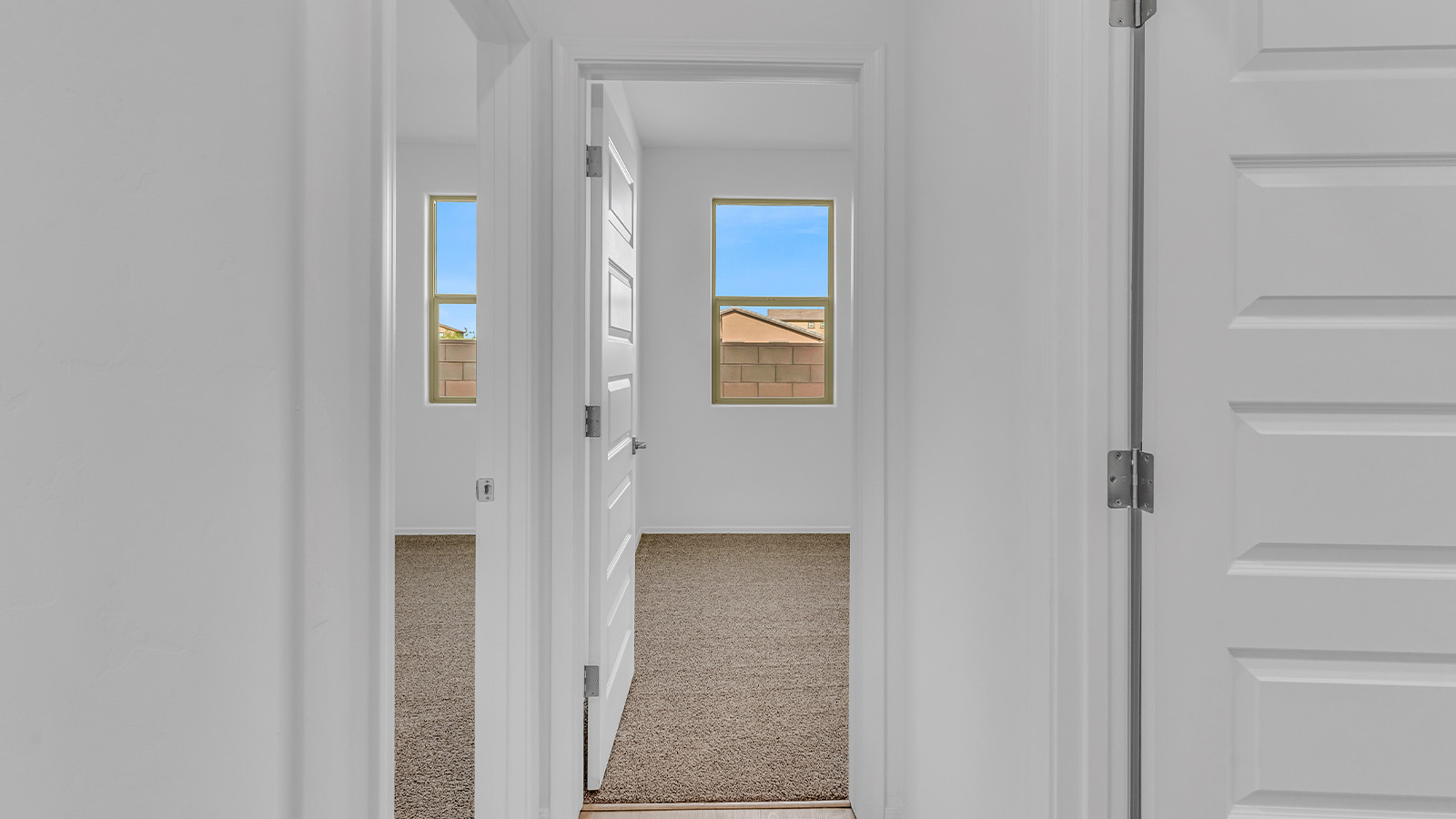 Introducing The Brooke at Coronet at Gladden Farms in Marana, Arizona – a unique 1,654 sq. ft. single-story new home designed for those who seek both comfort and style in a picturesque setting. Exclusively available at Coronet at Gladden Farms, this floorplan offers a one-of-a-kind living experience you won’t find anywhere else.  As you enter through the welcoming front porch, you’ll find yourself in a well-designed entryway that leads into the heart of the home. The great room, with its open and airy layout, is the perfect spot for gathering with family and friends. It flows seamlessly into the dining area and kitchen, creating an inviting space that’s ideal for everything from casual meals to entertaining guests.  The kitchen is the centerpiece of this home, featuring quartz countertops, modern appliances, and a large pantry that provides ample storage. The adjacent dining area offers a comfortable setting for meals, and the open-concept design ensures that the kitchen, dining, and living spaces are always connected.  The Brooke offers a well-thought-out floor plan with four bedrooms, making it perfect for families of all sizes. The master suite, located at the rear of the home, provides a private retreat with a spacious bedroom, a walk-in closet, and an en-suite bathroom complete with dual vanities and a walk-in shower. The additional three bedrooms are thoughtfully positioned near the second full bathroom, ensuring comfort and convenience for all.  A utility room and a two-car garage add practicality to the overall design, while the covered patio extends your living space outdoors. Here, you can enjoy Arizona’s beautiful weather and the stunning views that Coronet at Gladden Farms has to offer.  Designed with energy efficiency in mind, The Brooke at Coronet at Gladden Farms is a DOE Zero Energy Ready Home, providing a sustainable lifestyle with lower utility costs and a reduced environmental footprint.