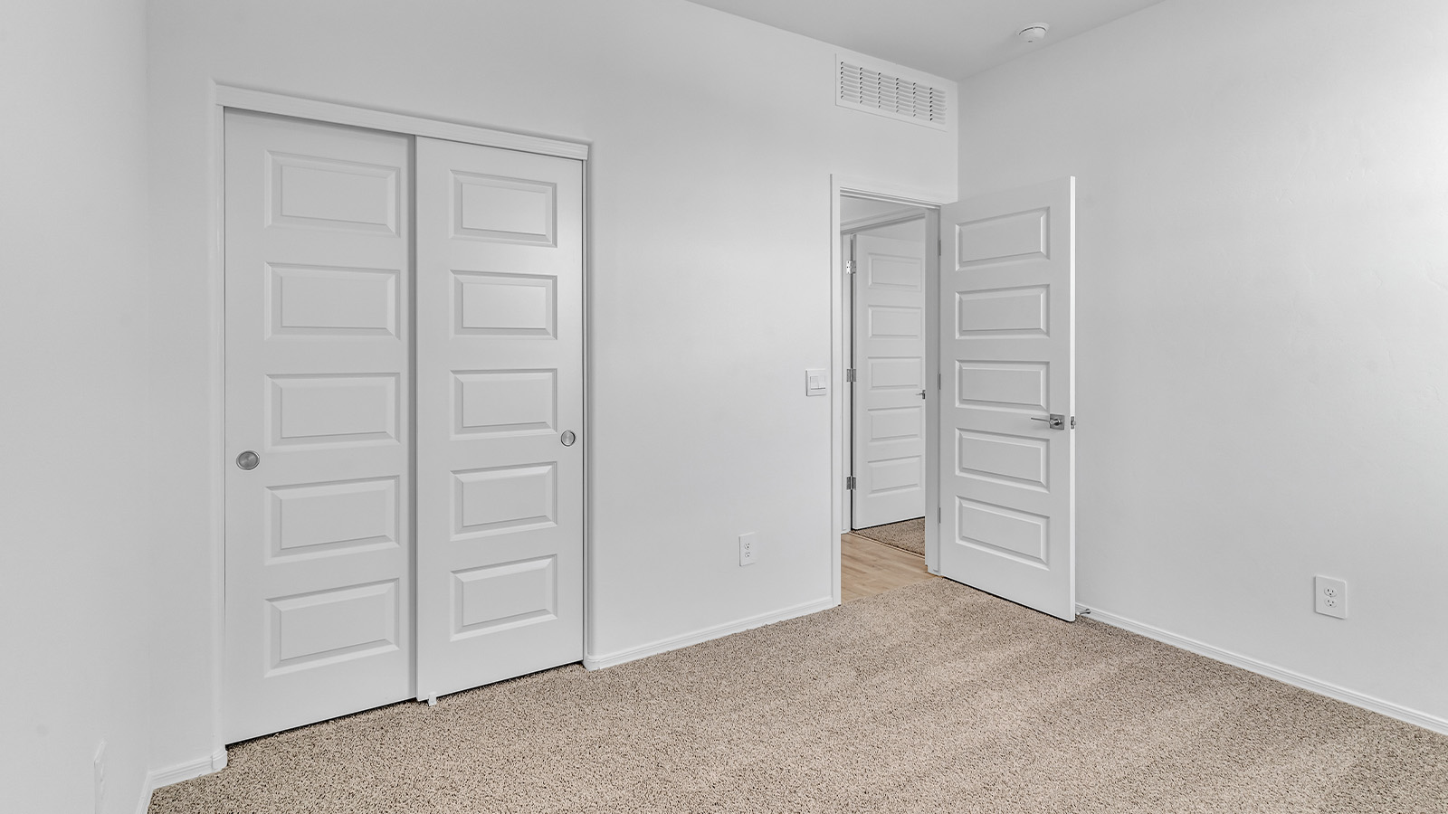 Introducing The Brooke at Coronet at Gladden Farms in Marana, Arizona – a unique 1,654 sq. ft. single-story new home designed for those who seek both comfort and style in a picturesque setting. Exclusively available at Coronet at Gladden Farms, this floorplan offers a one-of-a-kind living experience you won’t find anywhere else.  As you enter through the welcoming front porch, you’ll find yourself in a well-designed entryway that leads into the heart of the home. The great room, with its open and airy layout, is the perfect spot for gathering with family and friends. It flows seamlessly into the dining area and kitchen, creating an inviting space that’s ideal for everything from casual meals to entertaining guests.  The kitchen is the centerpiece of this home, featuring quartz countertops, modern appliances, and a large pantry that provides ample storage. The adjacent dining area offers a comfortable setting for meals, and the open-concept design ensures that the kitchen, dining, and living spaces are always connected.  The Brooke offers a well-thought-out floor plan with four bedrooms, making it perfect for families of all sizes. The master suite, located at the rear of the home, provides a private retreat with a spacious bedroom, a walk-in closet, and an en-suite bathroom complete with dual vanities and a walk-in shower. The additional three bedrooms are thoughtfully positioned near the second full bathroom, ensuring comfort and convenience for all.  A utility room and a two-car garage add practicality to the overall design, while the covered patio extends your living space outdoors. Here, you can enjoy Arizona’s beautiful weather and the stunning views that Coronet at Gladden Farms has to offer.  Designed with energy efficiency in mind, The Brooke at Coronet at Gladden Farms is a DOE Zero Energy Ready Home, providing a sustainable lifestyle with lower utility costs and a reduced environmental footprint.