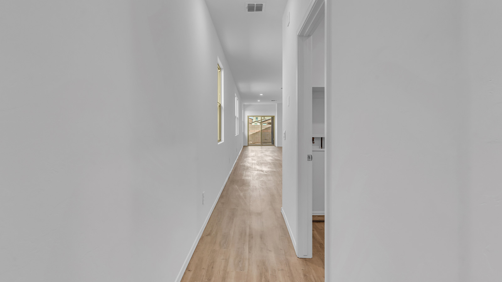 Introducing The Brooke at Coronet at Gladden Farms in Marana, Arizona – a unique 1,654 sq. ft. single-story new home designed for those who seek both comfort and style in a picturesque setting. Exclusively available at Coronet at Gladden Farms, this floorplan offers a one-of-a-kind living experience you won’t find anywhere else.  As you enter through the welcoming front porch, you’ll find yourself in a well-designed entryway that leads into the heart of the home. The great room, with its open and airy layout, is the perfect spot for gathering with family and friends. It flows seamlessly into the dining area and kitchen, creating an inviting space that’s ideal for everything from casual meals to entertaining guests.  The kitchen is the centerpiece of this home, featuring quartz countertops, modern appliances, and a large pantry that provides ample storage. The adjacent dining area offers a comfortable setting for meals, and the open-concept design ensures that the kitchen, dining, and living spaces are always connected.  The Brooke offers a well-thought-out floor plan with four bedrooms, making it perfect for families of all sizes. The master suite, located at the rear of the home, provides a private retreat with a spacious bedroom, a walk-in closet, and an en-suite bathroom complete with dual vanities and a walk-in shower. The additional three bedrooms are thoughtfully positioned near the second full bathroom, ensuring comfort and convenience for all.  A utility room and a two-car garage add practicality to the overall design, while the covered patio extends your living space outdoors. Here, you can enjoy Arizona’s beautiful weather and the stunning views that Coronet at Gladden Farms has to offer.  Designed with energy efficiency in mind, The Brooke at Coronet at Gladden Farms is a DOE Zero Energy Ready Home, providing a sustainable lifestyle with lower utility costs and a reduced environmental footprint.