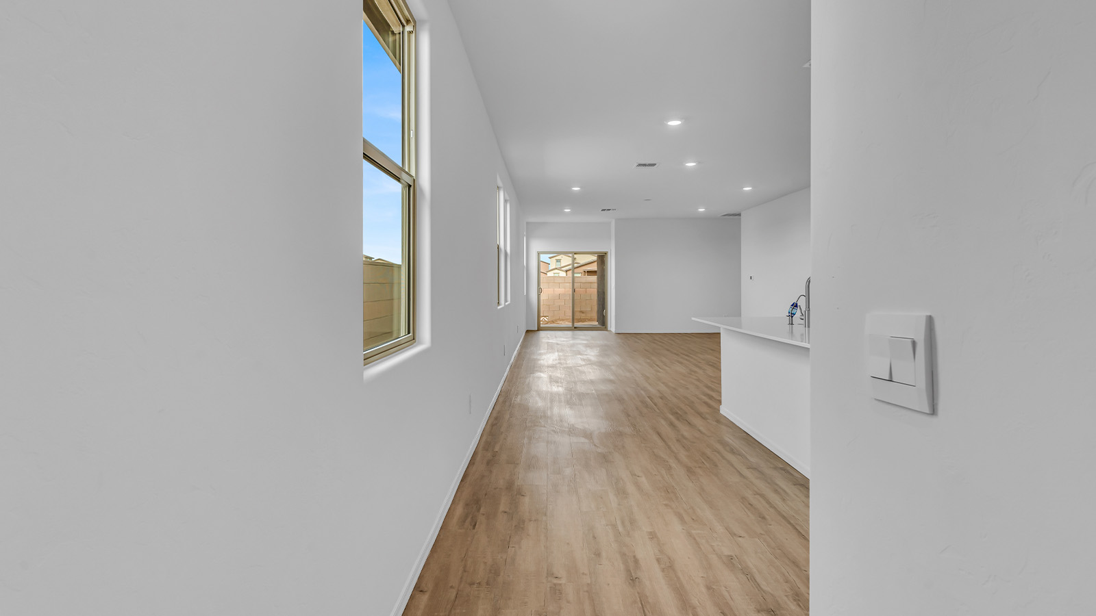 Introducing The Brooke at Coronet at Gladden Farms in Marana, Arizona – a unique 1,654 sq. ft. single-story new home designed for those who seek both comfort and style in a picturesque setting. Exclusively available at Coronet at Gladden Farms, this floorplan offers a one-of-a-kind living experience you won’t find anywhere else.  As you enter through the welcoming front porch, you’ll find yourself in a well-designed entryway that leads into the heart of the home. The great room, with its open and airy layout, is the perfect spot for gathering with family and friends. It flows seamlessly into the dining area and kitchen, creating an inviting space that’s ideal for everything from casual meals to entertaining guests.  The kitchen is the centerpiece of this home, featuring quartz countertops, modern appliances, and a large pantry that provides ample storage. The adjacent dining area offers a comfortable setting for meals, and the open-concept design ensures that the kitchen, dining, and living spaces are always connected.  The Brooke offers a well-thought-out floor plan with four bedrooms, making it perfect for families of all sizes. The master suite, located at the rear of the home, provides a private retreat with a spacious bedroom, a walk-in closet, and an en-suite bathroom complete with dual vanities and a walk-in shower. The additional three bedrooms are thoughtfully positioned near the second full bathroom, ensuring comfort and convenience for all.  A utility room and a two-car garage add practicality to the overall design, while the covered patio extends your living space outdoors. Here, you can enjoy Arizona’s beautiful weather and the stunning views that Coronet at Gladden Farms has to offer.  Designed with energy efficiency in mind, The Brooke at Coronet at Gladden Farms is a DOE Zero Energy Ready Home, providing a sustainable lifestyle with lower utility costs and a reduced environmental footprint.