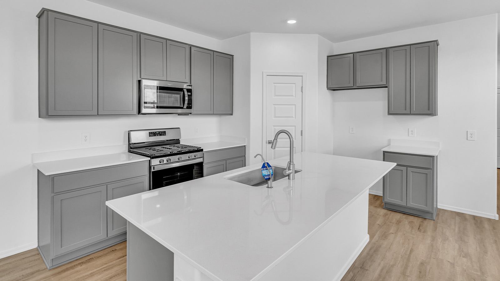 Introducing The Brooke at Coronet at Gladden Farms in Marana, Arizona – a unique 1,654 sq. ft. single-story new home designed for those who seek both comfort and style in a picturesque setting. Exclusively available at Coronet at Gladden Farms, this floorplan offers a one-of-a-kind living experience you won’t find anywhere else.  As you enter through the welcoming front porch, you’ll find yourself in a well-designed entryway that leads into the heart of the home. The great room, with its open and airy layout, is the perfect spot for gathering with family and friends. It flows seamlessly into the dining area and kitchen, creating an inviting space that’s ideal for everything from casual meals to entertaining guests.  The kitchen is the centerpiece of this home, featuring quartz countertops, modern appliances, and a large pantry that provides ample storage. The adjacent dining area offers a comfortable setting for meals, and the open-concept design ensures that the kitchen, dining, and living spaces are always connected.  The Brooke offers a well-thought-out floor plan with four bedrooms, making it perfect for families of all sizes. The master suite, located at the rear of the home, provides a private retreat with a spacious bedroom, a walk-in closet, and an en-suite bathroom complete with dual vanities and a walk-in shower. The additional three bedrooms are thoughtfully positioned near the second full bathroom, ensuring comfort and convenience for all.  A utility room and a two-car garage add practicality to the overall design, while the covered patio extends your living space outdoors. Here, you can enjoy Arizona’s beautiful weather and the stunning views that Coronet at Gladden Farms has to offer.  Designed with energy efficiency in mind, The Brooke at Coronet at Gladden Farms is a DOE Zero Energy Ready Home, providing a sustainable lifestyle with lower utility costs and a reduced environmental footprint.