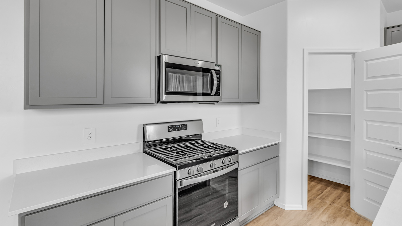 Introducing The Brooke at Coronet at Gladden Farms in Marana, Arizona – a unique 1,654 sq. ft. single-story new home designed for those who seek both comfort and style in a picturesque setting. Exclusively available at Coronet at Gladden Farms, this floorplan offers a one-of-a-kind living experience you won’t find anywhere else.  As you enter through the welcoming front porch, you’ll find yourself in a well-designed entryway that leads into the heart of the home. The great room, with its open and airy layout, is the perfect spot for gathering with family and friends. It flows seamlessly into the dining area and kitchen, creating an inviting space that’s ideal for everything from casual meals to entertaining guests.  The kitchen is the centerpiece of this home, featuring quartz countertops, modern appliances, and a large pantry that provides ample storage. The adjacent dining area offers a comfortable setting for meals, and the open-concept design ensures that the kitchen, dining, and living spaces are always connected.  The Brooke offers a well-thought-out floor plan with four bedrooms, making it perfect for families of all sizes. The master suite, located at the rear of the home, provides a private retreat with a spacious bedroom, a walk-in closet, and an en-suite bathroom complete with dual vanities and a walk-in shower. The additional three bedrooms are thoughtfully positioned near the second full bathroom, ensuring comfort and convenience for all.  A utility room and a two-car garage add practicality to the overall design, while the covered patio extends your living space outdoors. Here, you can enjoy Arizona’s beautiful weather and the stunning views that Coronet at Gladden Farms has to offer.  Designed with energy efficiency in mind, The Brooke at Coronet at Gladden Farms is a DOE Zero Energy Ready Home, providing a sustainable lifestyle with lower utility costs and a reduced environmental footprint.