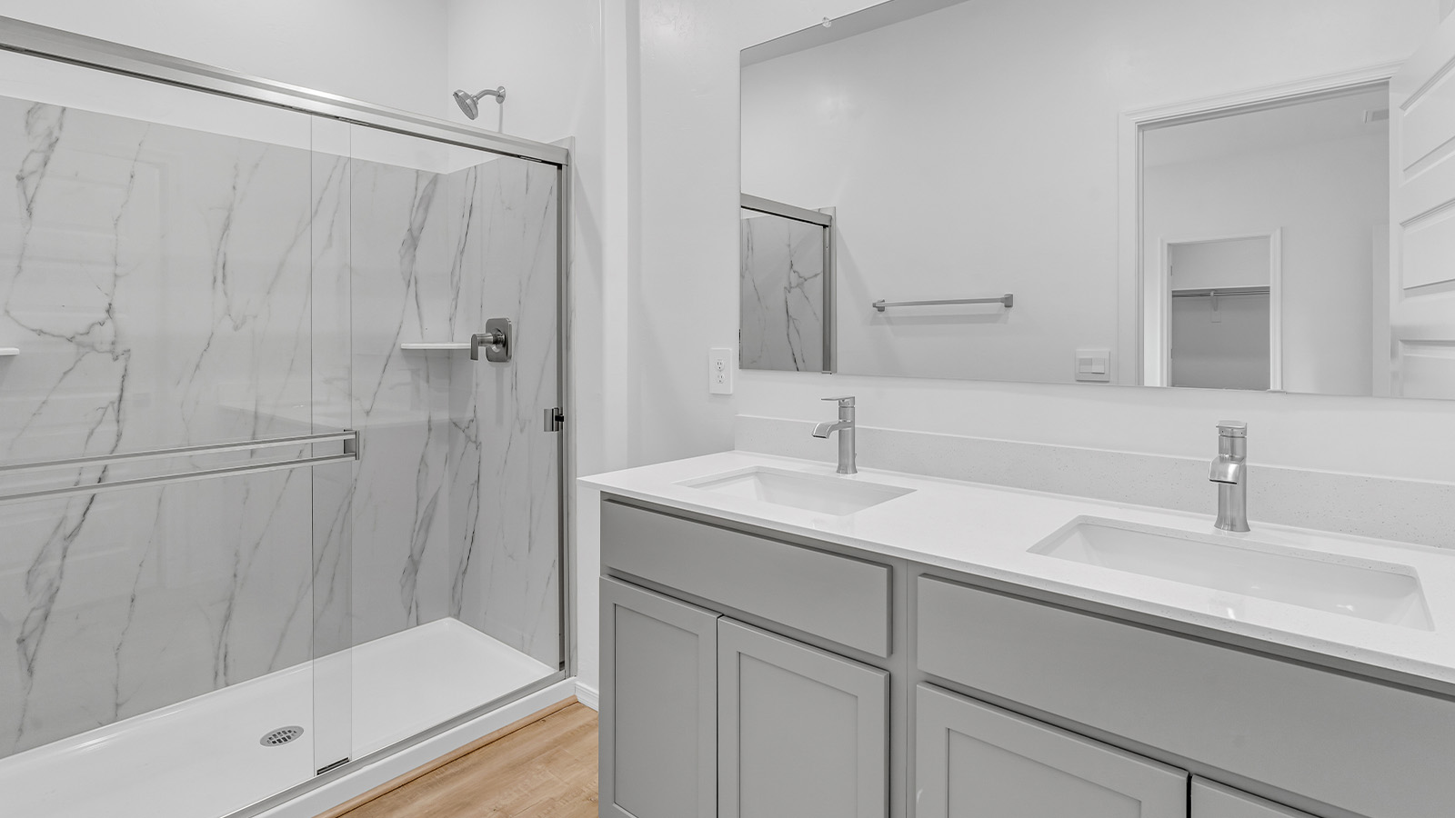 Introducing The Brooke at Coronet at Gladden Farms in Marana, Arizona – a unique 1,654 sq. ft. single-story new home designed for those who seek both comfort and style in a picturesque setting. Exclusively available at Coronet at Gladden Farms, this floorplan offers a one-of-a-kind living experience you won’t find anywhere else.  As you enter through the welcoming front porch, you’ll find yourself in a well-designed entryway that leads into the heart of the home. The great room, with its open and airy layout, is the perfect spot for gathering with family and friends. It flows seamlessly into the dining area and kitchen, creating an inviting space that’s ideal for everything from casual meals to entertaining guests.  The kitchen is the centerpiece of this home, featuring quartz countertops, modern appliances, and a large pantry that provides ample storage. The adjacent dining area offers a comfortable setting for meals, and the open-concept design ensures that the kitchen, dining, and living spaces are always connected.  The Brooke offers a well-thought-out floor plan with four bedrooms, making it perfect for families of all sizes. The master suite, located at the rear of the home, provides a private retreat with a spacious bedroom, a walk-in closet, and an en-suite bathroom complete with dual vanities and a walk-in shower. The additional three bedrooms are thoughtfully positioned near the second full bathroom, ensuring comfort and convenience for all.  A utility room and a two-car garage add practicality to the overall design, while the covered patio extends your living space outdoors. Here, you can enjoy Arizona’s beautiful weather and the stunning views that Coronet at Gladden Farms has to offer.  Designed with energy efficiency in mind, The Brooke at Coronet at Gladden Farms is a DOE Zero Energy Ready Home, providing a sustainable lifestyle with lower utility costs and a reduced environmental footprint.