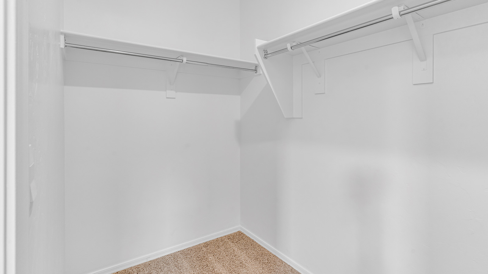 Introducing The Brooke at Coronet at Gladden Farms in Marana, Arizona – a unique 1,654 sq. ft. single-story new home designed for those who seek both comfort and style in a picturesque setting. Exclusively available at Coronet at Gladden Farms, this floorplan offers a one-of-a-kind living experience you won’t find anywhere else.  As you enter through the welcoming front porch, you’ll find yourself in a well-designed entryway that leads into the heart of the home. The great room, with its open and airy layout, is the perfect spot for gathering with family and friends. It flows seamlessly into the dining area and kitchen, creating an inviting space that’s ideal for everything from casual meals to entertaining guests.  The kitchen is the centerpiece of this home, featuring quartz countertops, modern appliances, and a large pantry that provides ample storage. The adjacent dining area offers a comfortable setting for meals, and the open-concept design ensures that the kitchen, dining, and living spaces are always connected.  The Brooke offers a well-thought-out floor plan with four bedrooms, making it perfect for families of all sizes. The master suite, located at the rear of the home, provides a private retreat with a spacious bedroom, a walk-in closet, and an en-suite bathroom complete with dual vanities and a walk-in shower. The additional three bedrooms are thoughtfully positioned near the second full bathroom, ensuring comfort and convenience for all.  A utility room and a two-car garage add practicality to the overall design, while the covered patio extends your living space outdoors. Here, you can enjoy Arizona’s beautiful weather and the stunning views that Coronet at Gladden Farms has to offer.  Designed with energy efficiency in mind, The Brooke at Coronet at Gladden Farms is a DOE Zero Energy Ready Home, providing a sustainable lifestyle with lower utility costs and a reduced environmental footprint.