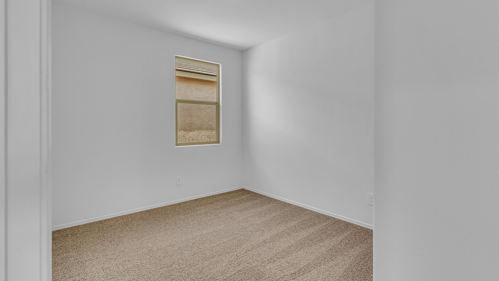 Introducing The Brooke at Coronet at Gladden Farms in Marana, Arizona – a unique 1,654 sq. ft. single-story new home designed for those who seek both comfort and style in a picturesque setting. Exclusively available at Coronet at Gladden Farms, this floorplan offers a one-of-a-kind living experience you won’t find anywhere else.  As you enter through the welcoming front porch, you’ll find yourself in a well-designed entryway that leads into the heart of the home. The great room, with its open and airy layout, is the perfect spot for gathering with family and friends. It flows seamlessly into the dining area and kitchen, creating an inviting space that’s ideal for everything from casual meals to entertaining guests.  The kitchen is the centerpiece of this home, featuring quartz countertops, modern appliances, and a large pantry that provides ample storage. The adjacent dining area offers a comfortable setting for meals, and the open-concept design ensures that the kitchen, dining, and living spaces are always connected.  The Brooke offers a well-thought-out floor plan with four bedrooms, making it perfect for families of all sizes. The master suite, located at the rear of the home, provides a private retreat with a spacious bedroom, a walk-in closet, and an en-suite bathroom complete with dual vanities and a walk-in shower. The additional three bedrooms are thoughtfully positioned near the second full bathroom, ensuring comfort and convenience for all.  A utility room and a two-car garage add practicality to the overall design, while the covered patio extends your living space outdoors. Here, you can enjoy Arizona’s beautiful weather and the stunning views that Coronet at Gladden Farms has to offer.  Designed with energy efficiency in mind, The Brooke at Coronet at Gladden Farms is a DOE Zero Energy Ready Home, providing a sustainable lifestyle with lower utility costs and a reduced environmental footprint.