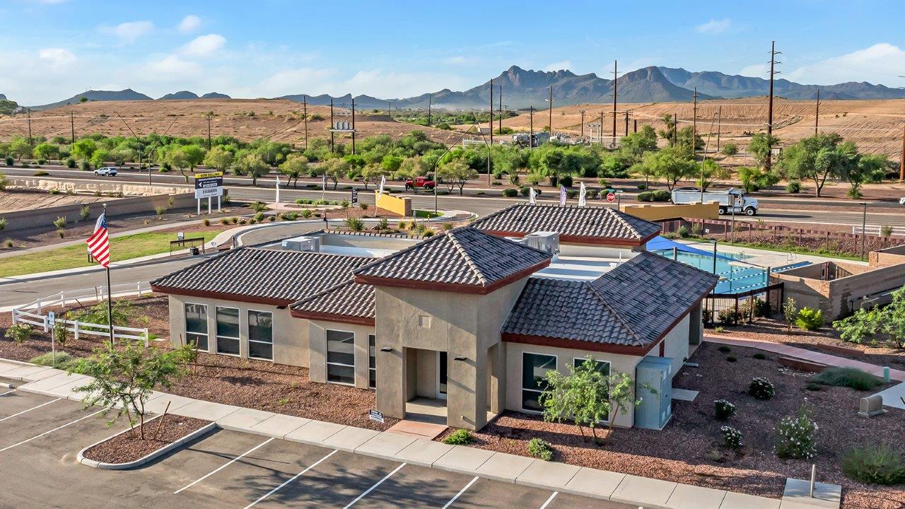 Introducing The Grace at Coronet at Gladden Farms in Marana, Arizona – a spacious 1,965 sq. ft. two-story home that combines modern living with the charm of a vibrant community.  As you enter through the welcoming front porch, the entryway leads you into the open layout of the main floor. Here, the great room seamlessly connects to the dining area and kitchen, creating a perfect space for family gatherings and entertaining. The kitchen is equipped with modern appliances and ample storage space, making meal preparation and entertaining a pleasure.  The main floor also features a convenient powder room for guests, as well as direct access to the two-car garage, enhancing the home’s practicality.  Heading upstairs, you’ll find the homes private quarters. The primary suite offers a peaceful retreat, complete with a generously sized bedroom, a large walk-in closet, and an en-suite bathroom with walk-in shower. The upper level also includes three additional bedrooms, a full bathroom, and a centrally located utility room for added convenience. A versatile loft area provides additional living space that can be customized to suit your family’s needs.  The Grace is designed with energy efficiency in mind and features a tankless water heater, energy-efficient LED lighting, and high-performance insulation, helping to lower utility costs.  Living at Coronet at Gladden Farms means enjoying a community that values both comfort and outdoor adventure. With access to 830 acres of green space, parks, playgrounds, and exclusive amenities like a sparkling pool, fitness center, and clubhouse, this community is perfect for families and active lifestyles.