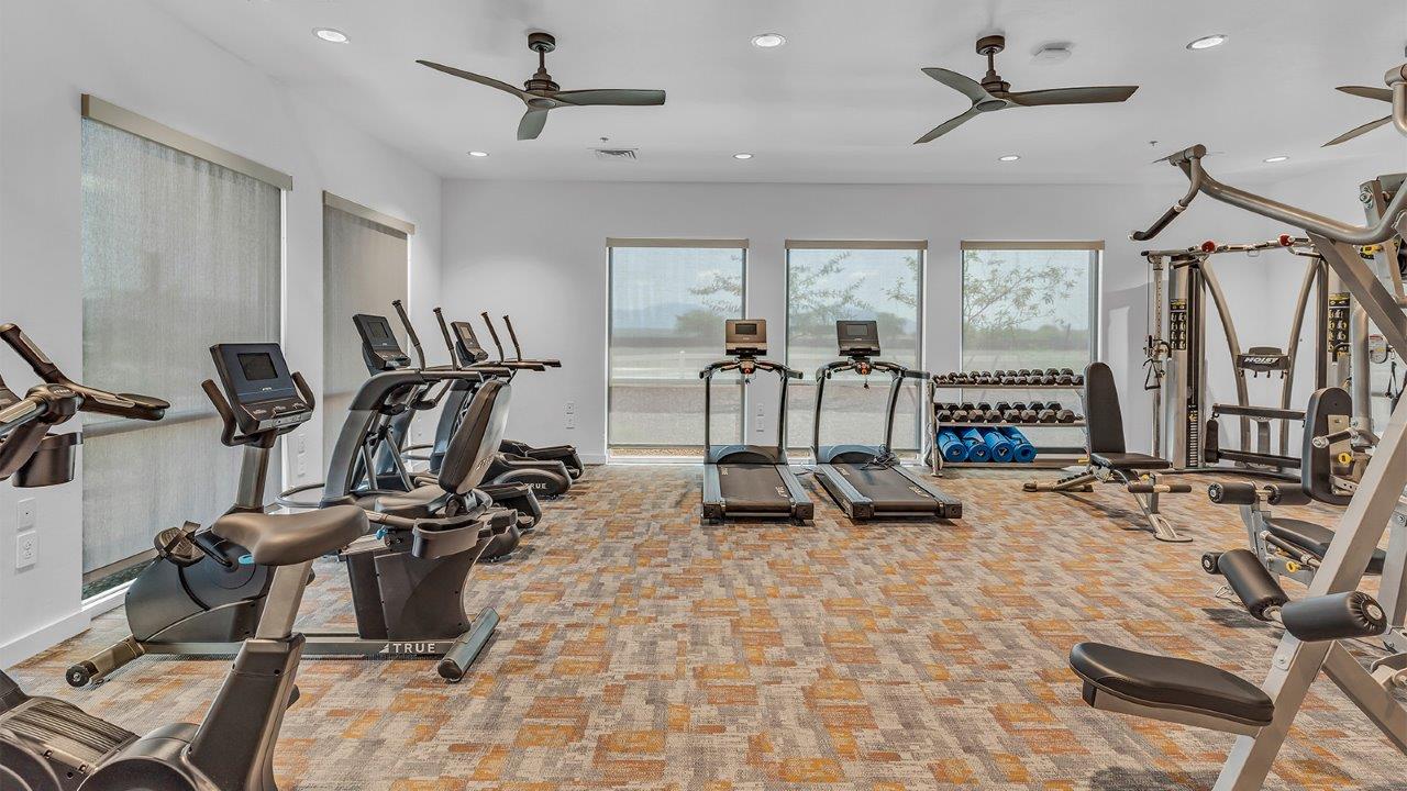 Introducing The Grace at Coronet at Gladden Farms in Marana, Arizona – a spacious 1,965 sq. ft. two-story home that combines modern living with the charm of a vibrant community.  As you enter through the welcoming front porch, the entryway leads you into the open layout of the main floor. Here, the great room seamlessly connects to the dining area and kitchen, creating a perfect space for family gatherings and entertaining. The kitchen is equipped with modern appliances and ample storage space, making meal preparation and entertaining a pleasure.  The main floor also features a convenient powder room for guests, as well as direct access to the two-car garage, enhancing the home’s practicality.  Heading upstairs, you’ll find the homes private quarters. The primary suite offers a peaceful retreat, complete with a generously sized bedroom, a large walk-in closet, and an en-suite bathroom with walk-in shower. The upper level also includes three additional bedrooms, a full bathroom, and a centrally located utility room for added convenience. A versatile loft area provides additional living space that can be customized to suit your family’s needs.  The Grace is designed with energy efficiency in mind and features a tankless water heater, energy-efficient LED lighting, and high-performance insulation, helping to lower utility costs.  Living at Coronet at Gladden Farms means enjoying a community that values both comfort and outdoor adventure. With access to 830 acres of green space, parks, playgrounds, and exclusive amenities like a sparkling pool, fitness center, and clubhouse, this community is perfect for families and active lifestyles.