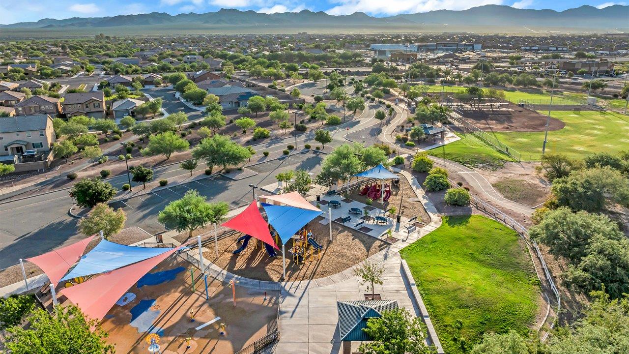 Introducing The Grace at Coronet at Gladden Farms in Marana, Arizona – a spacious 1,965 sq. ft. two-story home that combines modern living with the charm of a vibrant community.  As you enter through the welcoming front porch, the entryway leads you into the open layout of the main floor. Here, the great room seamlessly connects to the dining area and kitchen, creating a perfect space for family gatherings and entertaining. The kitchen is equipped with modern appliances and ample storage space, making meal preparation and entertaining a pleasure.  The main floor also features a convenient powder room for guests, as well as direct access to the two-car garage, enhancing the home’s practicality.  Heading upstairs, you’ll find the homes private quarters. The primary suite offers a peaceful retreat, complete with a generously sized bedroom, a large walk-in closet, and an en-suite bathroom with walk-in shower. The upper level also includes three additional bedrooms, a full bathroom, and a centrally located utility room for added convenience. A versatile loft area provides additional living space that can be customized to suit your family’s needs.  The Grace is designed with energy efficiency in mind and features a tankless water heater, energy-efficient LED lighting, and high-performance insulation, helping to lower utility costs.  Living at Coronet at Gladden Farms means enjoying a community that values both comfort and outdoor adventure. With access to 830 acres of green space, parks, playgrounds, and exclusive amenities like a sparkling pool, fitness center, and clubhouse, this community is perfect for families and active lifestyles.