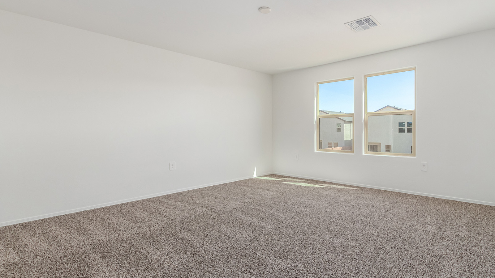 Introducing The Grace at Coronet at Gladden Farms in Marana, Arizona – a spacious 1,965 sq. ft. two-story home that combines modern living with the charm of a vibrant community.  As you enter through the welcoming front porch, the entryway leads you into the open layout of the main floor. Here, the great room seamlessly connects to the dining area and kitchen, creating a perfect space for family gatherings and entertaining. The kitchen, equipped with quartz countertops, modern appliances, and a large pantry, is as functional as it is stylish, making meal preparation a pleasure.  The main floor also features a convenient powder room for guests, as well as direct access to the two-car garage, enhancing the home’s practicality. Just off the kitchen, the covered patio extends your living space outdoors, providing a great spot to enjoy Arizona’s beautiful weather.  Heading upstairs, you’ll find the family’s private quarters. The primary suite offers a peaceful retreat, complete with a generously sized bedroom, a large walk-in closet, and an en-suite bathroom with walk-in shower. The upper level also includes three additional bedrooms, a full bathroom, and a centrally located utility room for added convenience. A versatile loft area provides additional living space that can be customized to suit your family’s needs.  The Grace is designed with energy efficiency in mind. This DOE Zero Energy Ready Home offers a sustainable lifestyle with advanced features like tankless water heaters, energy-efficient LED lighting, and high-performance insulation, ensuring lower utility costs and a reduced environmental footprint.  Living at Coronet at Gladden Farms means enjoying a community that values both comfort and outdoor adventure. With access to 830 acres of green space, parks, playgrounds, and exclusive amenities like a sparkling pool, fitness center, and clubhouse, this community is perfect for families and active lifestyles.