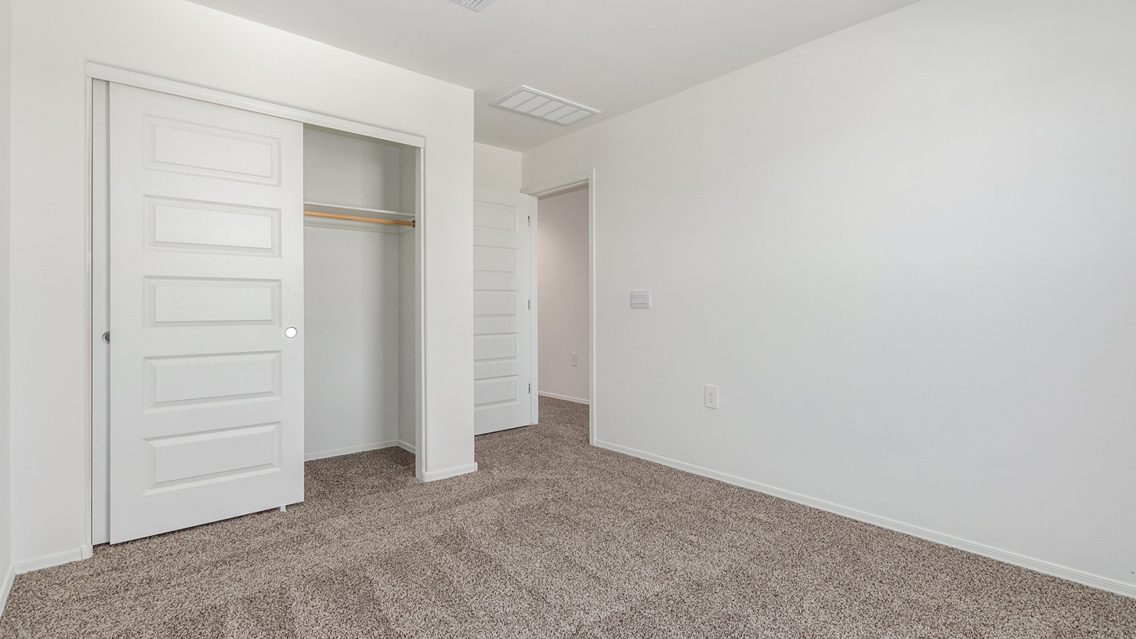 Introducing The Grace at Coronet at Gladden Farms in Marana, Arizona – a spacious 1,965 sq. ft. two-story home that combines modern living with the charm of a vibrant community.  As you enter through the welcoming front porch, the entryway leads you into the open layout of the main floor. Here, the great room seamlessly connects to the dining area and kitchen, creating a perfect space for family gatherings and entertaining. The kitchen, equipped with quartz countertops, modern appliances, and a large pantry, is as functional as it is stylish, making meal preparation a pleasure.  The main floor also features a convenient powder room for guests, as well as direct access to the two-car garage, enhancing the home’s practicality. Just off the kitchen, the covered patio extends your living space outdoors, providing a great spot to enjoy Arizona’s beautiful weather.  Heading upstairs, you’ll find the family’s private quarters. The primary suite offers a peaceful retreat, complete with a generously sized bedroom, a large walk-in closet, and an en-suite bathroom with walk-in shower. The upper level also includes three additional bedrooms, a full bathroom, and a centrally located utility room for added convenience. A versatile loft area provides additional living space that can be customized to suit your family’s needs.  The Grace is designed with energy efficiency in mind. This DOE Zero Energy Ready Home offers a sustainable lifestyle with advanced features like tankless water heaters, energy-efficient LED lighting, and high-performance insulation, ensuring lower utility costs and a reduced environmental footprint.  Living at Coronet at Gladden Farms means enjoying a community that values both comfort and outdoor adventure. With access to 830 acres of green space, parks, playgrounds, and exclusive amenities like a sparkling pool, fitness center, and clubhouse, this community is perfect for families and active lifestyles.