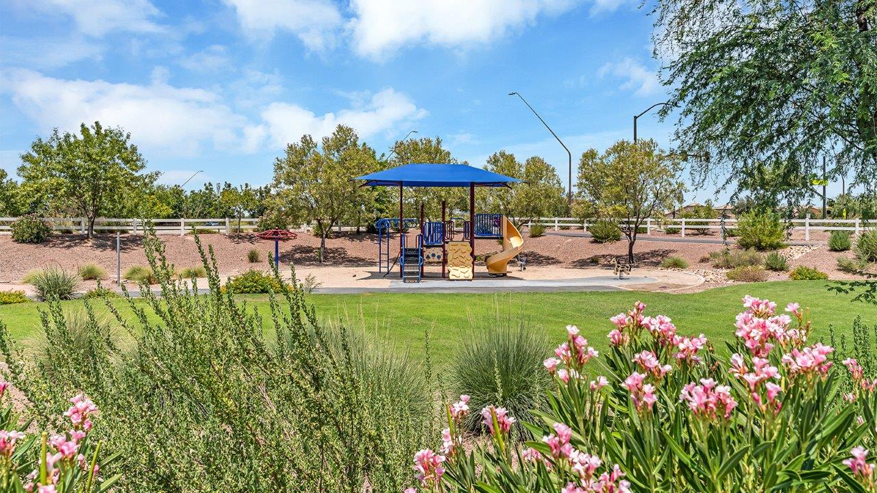 Introducing The Grace at Coronet at Gladden Farms in Marana, Arizona – a spacious 1,965 sq. ft. two-story home that combines modern living with the charm of a vibrant community.  As you enter through the welcoming front porch, the entryway leads you into the open layout of the main floor. Here, the great room seamlessly connects to the dining area and kitchen, creating a perfect space for family gatherings and entertaining. The kitchen, equipped with quartz countertops, modern appliances, and a large pantry, is as functional as it is stylish, making meal preparation a pleasure.  The main floor also features a convenient powder room for guests, as well as direct access to the two-car garage, enhancing the home’s practicality. Just off the kitchen, the covered patio extends your living space outdoors, providing a great spot to enjoy Arizona’s beautiful weather.  Heading upstairs, you’ll find the family’s private quarters. The primary suite offers a peaceful retreat, complete with a generously sized bedroom, a large walk-in closet, and an en-suite bathroom with walk-in shower. The upper level also includes three additional bedrooms, a full bathroom, and a centrally located utility room for added convenience. A versatile loft area provides additional living space that can be customized to suit your family’s needs.  The Grace is designed with energy efficiency in mind. This DOE Zero Energy Ready Home offers a sustainable lifestyle with advanced features like tankless water heaters, energy-efficient LED lighting, and high-performance insulation, ensuring lower utility costs and a reduced environmental footprint.  Living at Coronet at Gladden Farms means enjoying a community that values both comfort and outdoor adventure. With access to 830 acres of green space, parks, playgrounds, and exclusive amenities like a sparkling pool, fitness center, and clubhouse, this community is perfect for families and active lifestyles.