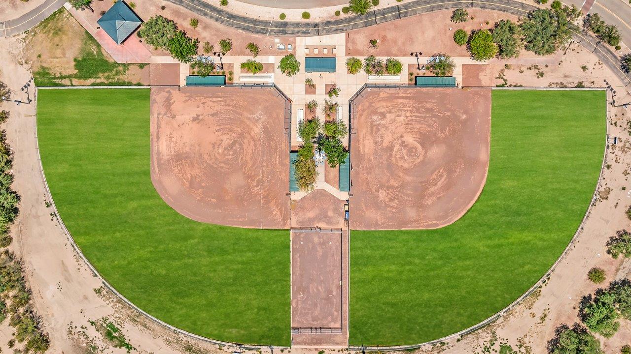 Introducing The Grace at Coronet at Gladden Farms in Marana, Arizona – a spacious 1,965 sq. ft. two-story home that combines modern living with the charm of a vibrant community.  As you enter through the welcoming front porch, the entryway leads you into the open layout of the main floor. Here, the great room seamlessly connects to the dining area and kitchen, creating a perfect space for family gatherings and entertaining. The kitchen, equipped with quartz countertops, modern appliances, and a large pantry, is as functional as it is stylish, making meal preparation a pleasure.  The main floor also features a convenient powder room for guests, as well as direct access to the two-car garage, enhancing the home’s practicality. Just off the kitchen, the covered patio extends your living space outdoors, providing a great spot to enjoy Arizona’s beautiful weather.  Heading upstairs, you’ll find the family’s private quarters. The primary suite offers a peaceful retreat, complete with a generously sized bedroom, a large walk-in closet, and an en-suite bathroom with walk-in shower. The upper level also includes three additional bedrooms, a full bathroom, and a centrally located utility room for added convenience. A versatile loft area provides additional living space that can be customized to suit your family’s needs.  The Grace is designed with energy efficiency in mind. This DOE Zero Energy Ready Home offers a sustainable lifestyle with advanced features like tankless water heaters, energy-efficient LED lighting, and high-performance insulation, ensuring lower utility costs and a reduced environmental footprint.  Living at Coronet at Gladden Farms means enjoying a community that values both comfort and outdoor adventure. With access to 830 acres of green space, parks, playgrounds, and exclusive amenities like a sparkling pool, fitness center, and clubhouse, this community is perfect for families and active lifestyles.