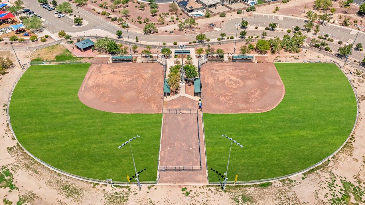 Introducing The Grace at Coronet at Gladden Farms in Marana, Arizona – a spacious 1,965 sq. ft. two-story home that combines modern living with the charm of a vibrant community.  As you enter through the welcoming front porch, the entryway leads you into the open layout of the main floor. Here, the great room seamlessly connects to the dining area and kitchen, creating a perfect space for family gatherings and entertaining. The kitchen, equipped with quartz countertops, modern appliances, and a large pantry, is as functional as it is stylish, making meal preparation a pleasure.  The main floor also features a convenient powder room for guests, as well as direct access to the two-car garage, enhancing the home’s practicality. Just off the kitchen, the covered patio extends your living space outdoors, providing a great spot to enjoy Arizona’s beautiful weather.  Heading upstairs, you’ll find the family’s private quarters. The primary suite offers a peaceful retreat, complete with a generously sized bedroom, a large walk-in closet, and an en-suite bathroom with walk-in shower. The upper level also includes three additional bedrooms, a full bathroom, and a centrally located utility room for added convenience. A versatile loft area provides additional living space that can be customized to suit your family’s needs.  The Grace is designed with energy efficiency in mind. This DOE Zero Energy Ready Home offers a sustainable lifestyle with advanced features like tankless water heaters, energy-efficient LED lighting, and high-performance insulation, ensuring lower utility costs and a reduced environmental footprint.  Living at Coronet at Gladden Farms means enjoying a community that values both comfort and outdoor adventure. With access to 830 acres of green space, parks, playgrounds, and exclusive amenities like a sparkling pool, fitness center, and clubhouse, this community is perfect for families and active lifestyles.