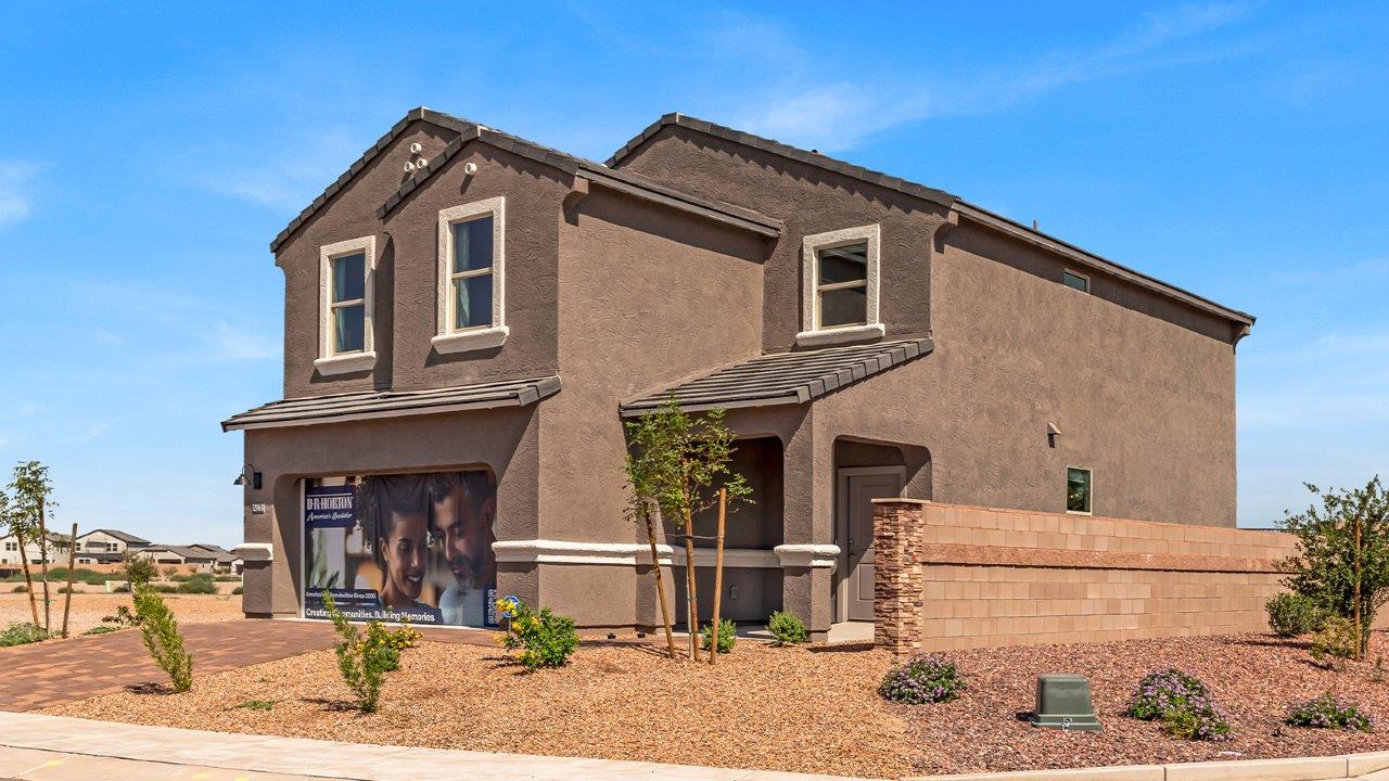 Welcome to The Kate at Coronet at Gladden Farms in Marana, Arizona – a spacious 2,227 sq. ft. two-story home designed to offer both luxury and practicality in a vibrant community setting.  As you step through the welcoming front porch, you’re greeted by an expansive entryway that leads into the heart of the home. The main floor features a generous great room that seamlessly flows into the dining area and kitchen, creating a perfect space for family gatherings and entertaining guests. The kitchen is a chef’s delight with modern appliances and ample storage space.  The main floor also includes a convenient powder room for guests and direct access to the two-car garage, enhancing the home’s functionality.  Upstairs, the primary suite offers a peaceful retreat, complete with a spacious bedroom, a large walk-in closet, and an en-suite bathroom and a walk-in shower. The upper level also includes three additional bedrooms, a full bathroom, and a centrally located utility room for added convenience. A versatile loft area provides additional living space, perfect for a playroom, home office, or secondary lounge.  The Kate in Coronet at Gladden Farms is designed with energy efficiency at its core featuring advanced energy-saving technologies such as a tankless water heater, energy-efficient LED lighting, and high-performance spray foam insulation, helping to lower utility costs.  Living at Coronet at Gladden Farms means more than just having a beautiful home. Residents enjoy access to 830 acres of green space, 28 parks, 19 playgrounds, and exclusive amenities like a sparkling community pool, fitness center, and clubhouse. The gated community also offers walking trails, a dog park, and close proximity to everyday conveniences, making it an ideal environment for families and active lifestyles.