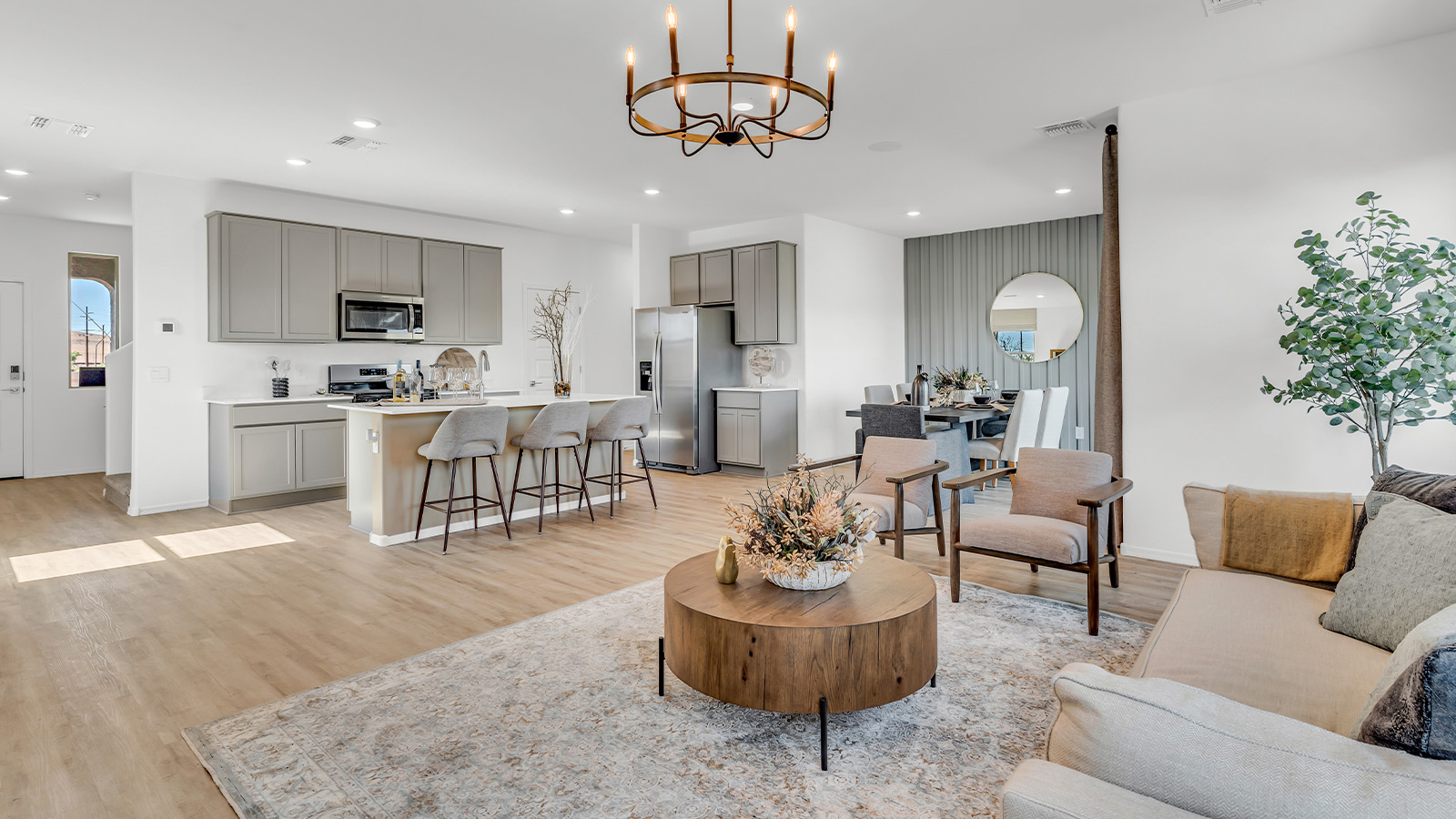 Welcome to The Kate at Coronet at Gladden Farms in Marana, Arizona – a spacious 2,227 sq. ft. two-story home designed to offer both luxury and practicality in a vibrant community setting.  As you step through the welcoming front porch, you’re greeted by an expansive entryway that leads into the heart of the home. The main floor features a generous great room that seamlessly flows into the dining area and kitchen, creating a perfect space for family gatherings and entertaining guests. The kitchen is a chef’s delight with modern appliances and ample storage space.  The main floor also includes a convenient powder room for guests and direct access to the two-car garage, enhancing the home’s functionality.  Upstairs, the primary suite offers a peaceful retreat, complete with a spacious bedroom, a large walk-in closet, and an en-suite bathroom and a walk-in shower. The upper level also includes three additional bedrooms, a full bathroom, and a centrally located utility room for added convenience. A versatile loft area provides additional living space, perfect for a playroom, home office, or secondary lounge.  The Kate in Coronet at Gladden Farms is designed with energy efficiency at its core featuring advanced energy-saving technologies such as a tankless water heater, energy-efficient LED lighting, and high-performance spray foam insulation, helping to lower utility costs.  Living at Coronet at Gladden Farms means more than just having a beautiful home. Residents enjoy access to 830 acres of green space, 28 parks, 19 playgrounds, and exclusive amenities like a sparkling community pool, fitness center, and clubhouse. The gated community also offers walking trails, a dog park, and close proximity to everyday conveniences, making it an ideal environment for families and active lifestyles.