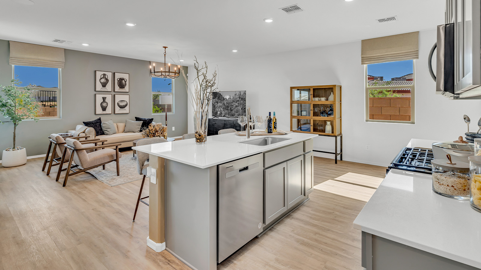 Welcome to The Kate at Coronet at Gladden Farms in Marana, Arizona – a spacious 2,227 sq. ft. two-story home designed to offer both luxury and practicality in a vibrant community setting.  As you step through the welcoming front porch, you’re greeted by an expansive entryway that leads into the heart of the home. The main floor features a generous great room that seamlessly flows into the dining area and kitchen, creating a perfect space for family gatherings and entertaining guests. The kitchen is a chef’s delight with modern appliances and ample storage space.  The main floor also includes a convenient powder room for guests and direct access to the two-car garage, enhancing the home’s functionality.  Upstairs, the primary suite offers a peaceful retreat, complete with a spacious bedroom, a large walk-in closet, and an en-suite bathroom and a walk-in shower. The upper level also includes three additional bedrooms, a full bathroom, and a centrally located utility room for added convenience. A versatile loft area provides additional living space, perfect for a playroom, home office, or secondary lounge.  The Kate in Coronet at Gladden Farms is designed with energy efficiency at its core featuring advanced energy-saving technologies such as a tankless water heater, energy-efficient LED lighting, and high-performance spray foam insulation, helping to lower utility costs.  Living at Coronet at Gladden Farms means more than just having a beautiful home. Residents enjoy access to 830 acres of green space, 28 parks, 19 playgrounds, and exclusive amenities like a sparkling community pool, fitness center, and clubhouse. The gated community also offers walking trails, a dog park, and close proximity to everyday conveniences, making it an ideal environment for families and active lifestyles.