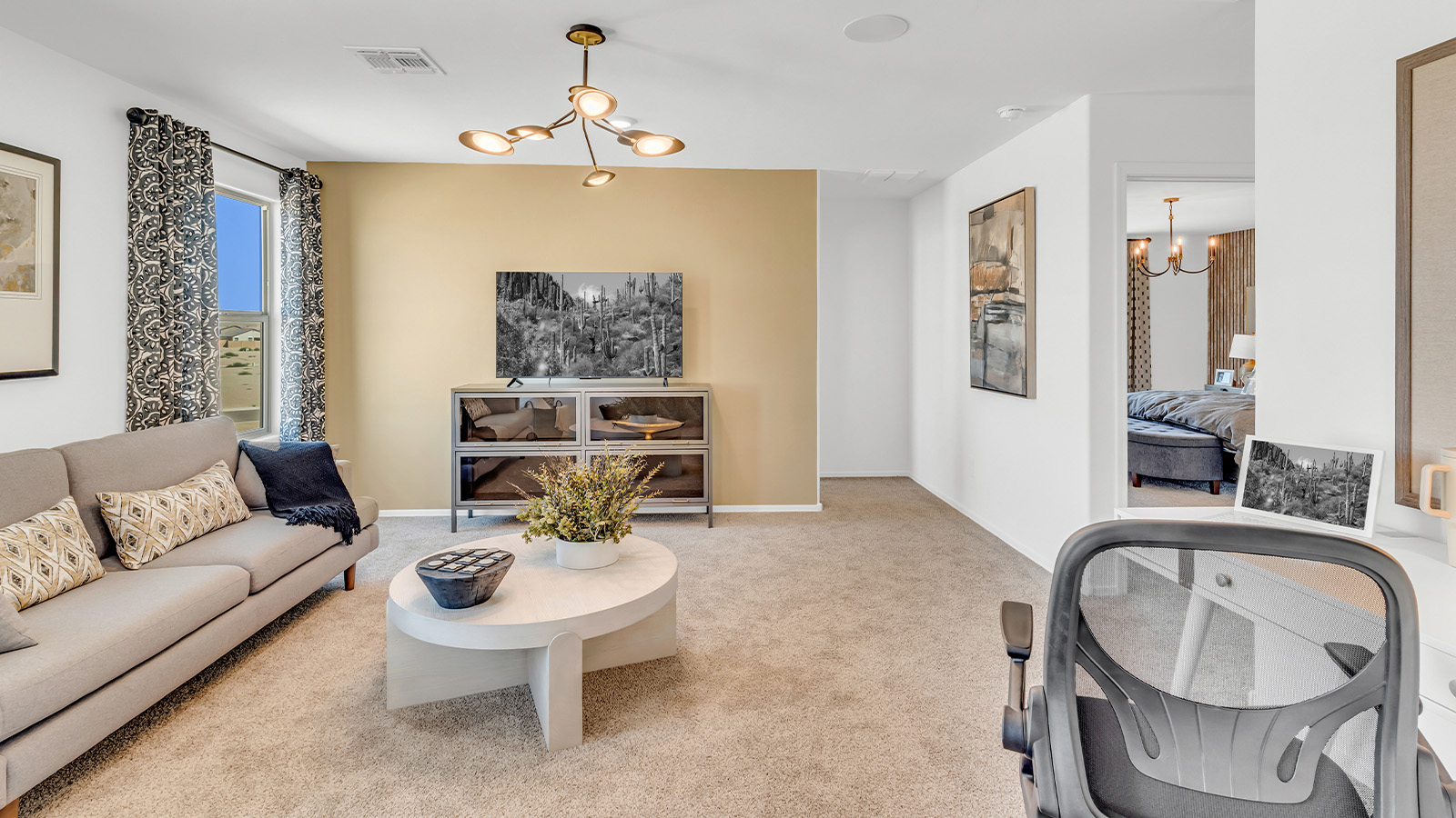Welcome to The Kate at Coronet at Gladden Farms in Marana, Arizona – a spacious 2,227 sq. ft. two-story home designed to offer both luxury and practicality in a vibrant community setting.  As you step through the welcoming front porch, you’re greeted by an expansive entryway that leads into the heart of the home. The main floor features a generous great room that seamlessly flows into the dining area and kitchen, creating a perfect space for family gatherings and entertaining guests. The kitchen is a chef’s delight with modern appliances and ample storage space.  The main floor also includes a convenient powder room for guests and direct access to the two-car garage, enhancing the home’s functionality.  Upstairs, the primary suite offers a peaceful retreat, complete with a spacious bedroom, a large walk-in closet, and an en-suite bathroom and a walk-in shower. The upper level also includes three additional bedrooms, a full bathroom, and a centrally located utility room for added convenience. A versatile loft area provides additional living space, perfect for a playroom, home office, or secondary lounge.  The Kate in Coronet at Gladden Farms is designed with energy efficiency at its core featuring advanced energy-saving technologies such as a tankless water heater, energy-efficient LED lighting, and high-performance spray foam insulation, helping to lower utility costs.  Living at Coronet at Gladden Farms means more than just having a beautiful home. Residents enjoy access to 830 acres of green space, 28 parks, 19 playgrounds, and exclusive amenities like a sparkling community pool, fitness center, and clubhouse. The gated community also offers walking trails, a dog park, and close proximity to everyday conveniences, making it an ideal environment for families and active lifestyles.