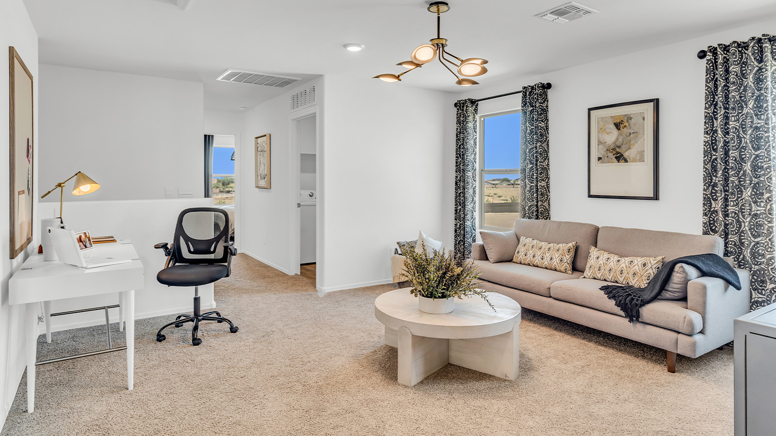 Welcome to The Kate at Coronet at Gladden Farms in Marana, Arizona – a spacious 2,227 sq. ft. two-story home designed to offer both luxury and practicality in a vibrant community setting.  As you step through the welcoming front porch, you’re greeted by an expansive entryway that leads into the heart of the home. The main floor features a generous great room that seamlessly flows into the dining area and kitchen, creating a perfect space for family gatherings and entertaining guests. The kitchen is a chef’s delight with modern appliances and ample storage space.  The main floor also includes a convenient powder room for guests and direct access to the two-car garage, enhancing the home’s functionality.  Upstairs, the primary suite offers a peaceful retreat, complete with a spacious bedroom, a large walk-in closet, and an en-suite bathroom and a walk-in shower. The upper level also includes three additional bedrooms, a full bathroom, and a centrally located utility room for added convenience. A versatile loft area provides additional living space, perfect for a playroom, home office, or secondary lounge.  The Kate in Coronet at Gladden Farms is designed with energy efficiency at its core featuring advanced energy-saving technologies such as a tankless water heater, energy-efficient LED lighting, and high-performance spray foam insulation, helping to lower utility costs.  Living at Coronet at Gladden Farms means more than just having a beautiful home. Residents enjoy access to 830 acres of green space, 28 parks, 19 playgrounds, and exclusive amenities like a sparkling community pool, fitness center, and clubhouse. The gated community also offers walking trails, a dog park, and close proximity to everyday conveniences, making it an ideal environment for families and active lifestyles.