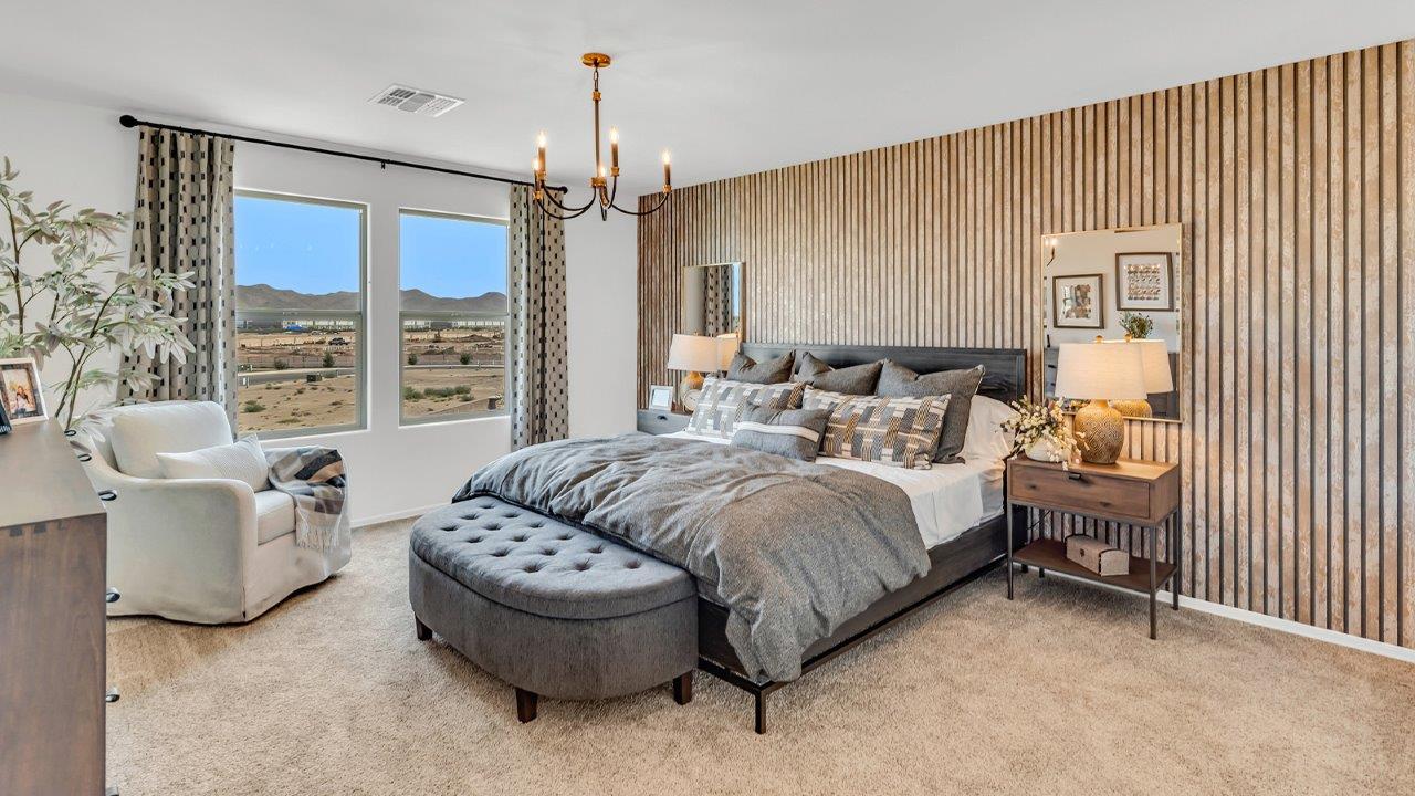 Welcome to The Kate at Coronet at Gladden Farms in Marana, Arizona – a spacious 2,227 sq. ft. two-story home designed to offer both luxury and practicality in a vibrant community setting.  As you step through the welcoming front porch, you’re greeted by an expansive entryway that leads into the heart of the home. The main floor features a generous great room that seamlessly flows into the dining area and kitchen, creating a perfect space for family gatherings and entertaining guests. The kitchen is a chef’s delight with modern appliances and ample storage space.  The main floor also includes a convenient powder room for guests and direct access to the two-car garage, enhancing the home’s functionality.  Upstairs, the primary suite offers a peaceful retreat, complete with a spacious bedroom, a large walk-in closet, and an en-suite bathroom and a walk-in shower. The upper level also includes three additional bedrooms, a full bathroom, and a centrally located utility room for added convenience. A versatile loft area provides additional living space, perfect for a playroom, home office, or secondary lounge.  The Kate in Coronet at Gladden Farms is designed with energy efficiency at its core featuring advanced energy-saving technologies such as a tankless water heater, energy-efficient LED lighting, and high-performance spray foam insulation, helping to lower utility costs.  Living at Coronet at Gladden Farms means more than just having a beautiful home. Residents enjoy access to 830 acres of green space, 28 parks, 19 playgrounds, and exclusive amenities like a sparkling community pool, fitness center, and clubhouse. The gated community also offers walking trails, a dog park, and close proximity to everyday conveniences, making it an ideal environment for families and active lifestyles.