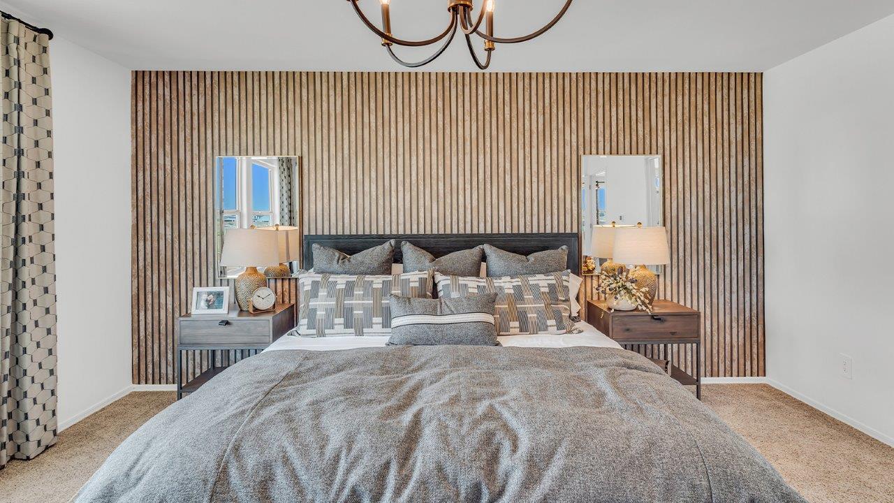 Welcome to The Kate at Coronet at Gladden Farms in Marana, Arizona – a spacious 2,227 sq. ft. two-story home designed to offer both luxury and practicality in a vibrant community setting.  As you step through the welcoming front porch, you’re greeted by an expansive entryway that leads into the heart of the home. The main floor features a generous great room that seamlessly flows into the dining area and kitchen, creating a perfect space for family gatherings and entertaining guests. The kitchen is a chef’s delight with modern appliances and ample storage space.  The main floor also includes a convenient powder room for guests and direct access to the two-car garage, enhancing the home’s functionality.  Upstairs, the primary suite offers a peaceful retreat, complete with a spacious bedroom, a large walk-in closet, and an en-suite bathroom and a walk-in shower. The upper level also includes three additional bedrooms, a full bathroom, and a centrally located utility room for added convenience. A versatile loft area provides additional living space, perfect for a playroom, home office, or secondary lounge.  The Kate in Coronet at Gladden Farms is designed with energy efficiency at its core featuring advanced energy-saving technologies such as a tankless water heater, energy-efficient LED lighting, and high-performance spray foam insulation, helping to lower utility costs.  Living at Coronet at Gladden Farms means more than just having a beautiful home. Residents enjoy access to 830 acres of green space, 28 parks, 19 playgrounds, and exclusive amenities like a sparkling community pool, fitness center, and clubhouse. The gated community also offers walking trails, a dog park, and close proximity to everyday conveniences, making it an ideal environment for families and active lifestyles.