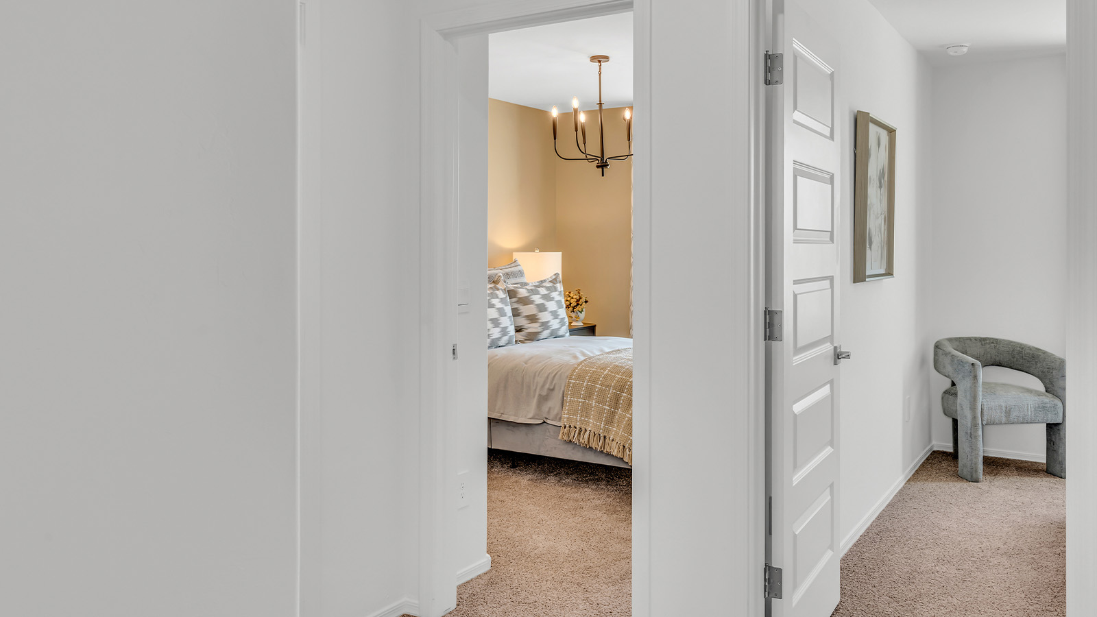 Welcome to The Kate at Coronet at Gladden Farms in Marana, Arizona – a spacious 2,227 sq. ft. two-story home designed to offer both luxury and practicality in a vibrant community setting.  As you step through the welcoming front porch, you’re greeted by an expansive entryway that leads into the heart of the home. The main floor features a generous great room that seamlessly flows into the dining area and kitchen, creating a perfect space for family gatherings and entertaining guests. The kitchen is a chef’s delight with modern appliances and ample storage space.  The main floor also includes a convenient powder room for guests and direct access to the two-car garage, enhancing the home’s functionality.  Upstairs, the primary suite offers a peaceful retreat, complete with a spacious bedroom, a large walk-in closet, and an en-suite bathroom and a walk-in shower. The upper level also includes three additional bedrooms, a full bathroom, and a centrally located utility room for added convenience. A versatile loft area provides additional living space, perfect for a playroom, home office, or secondary lounge.  The Kate in Coronet at Gladden Farms is designed with energy efficiency at its core featuring advanced energy-saving technologies such as a tankless water heater, energy-efficient LED lighting, and high-performance spray foam insulation, helping to lower utility costs.  Living at Coronet at Gladden Farms means more than just having a beautiful home. Residents enjoy access to 830 acres of green space, 28 parks, 19 playgrounds, and exclusive amenities like a sparkling community pool, fitness center, and clubhouse. The gated community also offers walking trails, a dog park, and close proximity to everyday conveniences, making it an ideal environment for families and active lifestyles.