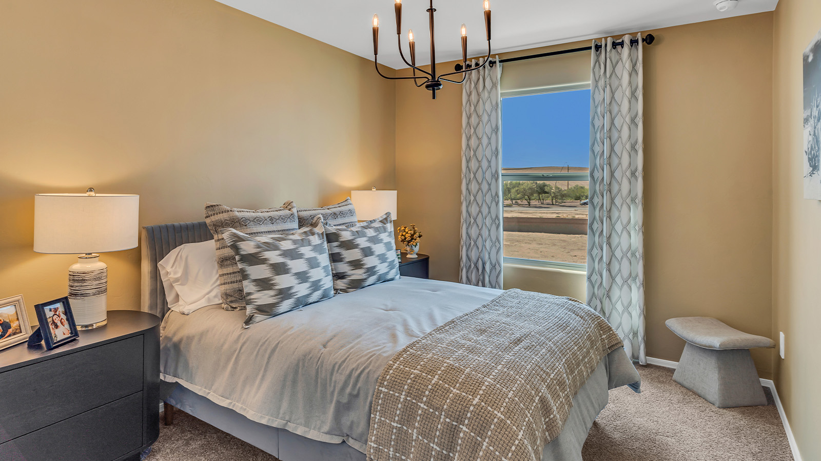 Welcome to The Kate at Coronet at Gladden Farms in Marana, Arizona – a spacious 2,227 sq. ft. two-story home designed to offer both luxury and practicality in a vibrant community setting.  As you step through the welcoming front porch, you’re greeted by an expansive entryway that leads into the heart of the home. The main floor features a generous great room that seamlessly flows into the dining area and kitchen, creating a perfect space for family gatherings and entertaining guests. The kitchen is a chef’s delight with modern appliances and ample storage space.  The main floor also includes a convenient powder room for guests and direct access to the two-car garage, enhancing the home’s functionality.  Upstairs, the primary suite offers a peaceful retreat, complete with a spacious bedroom, a large walk-in closet, and an en-suite bathroom and a walk-in shower. The upper level also includes three additional bedrooms, a full bathroom, and a centrally located utility room for added convenience. A versatile loft area provides additional living space, perfect for a playroom, home office, or secondary lounge.  The Kate in Coronet at Gladden Farms is designed with energy efficiency at its core featuring advanced energy-saving technologies such as a tankless water heater, energy-efficient LED lighting, and high-performance spray foam insulation, helping to lower utility costs.  Living at Coronet at Gladden Farms means more than just having a beautiful home. Residents enjoy access to 830 acres of green space, 28 parks, 19 playgrounds, and exclusive amenities like a sparkling community pool, fitness center, and clubhouse. The gated community also offers walking trails, a dog park, and close proximity to everyday conveniences, making it an ideal environment for families and active lifestyles.