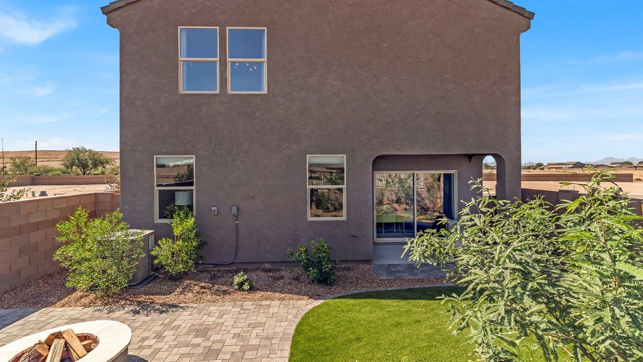 Welcome to The Kate at Coronet at Gladden Farms in Marana, Arizona – a spacious 2,227 sq. ft. two-story home designed to offer both luxury and practicality in a vibrant community setting.  As you step through the welcoming front porch, you’re greeted by an expansive entryway that leads into the heart of the home. The main floor features a generous great room that seamlessly flows into the dining area and kitchen, creating a perfect space for family gatherings and entertaining guests. The kitchen is a chef’s delight with modern appliances and ample storage space.  The main floor also includes a convenient powder room for guests and direct access to the two-car garage, enhancing the home’s functionality.  Upstairs, the primary suite offers a peaceful retreat, complete with a spacious bedroom, a large walk-in closet, and an en-suite bathroom and a walk-in shower. The upper level also includes three additional bedrooms, a full bathroom, and a centrally located utility room for added convenience. A versatile loft area provides additional living space, perfect for a playroom, home office, or secondary lounge.  The Kate in Coronet at Gladden Farms is designed with energy efficiency at its core featuring advanced energy-saving technologies such as a tankless water heater, energy-efficient LED lighting, and high-performance spray foam insulation, helping to lower utility costs.  Living at Coronet at Gladden Farms means more than just having a beautiful home. Residents enjoy access to 830 acres of green space, 28 parks, 19 playgrounds, and exclusive amenities like a sparkling community pool, fitness center, and clubhouse. The gated community also offers walking trails, a dog park, and close proximity to everyday conveniences, making it an ideal environment for families and active lifestyles.