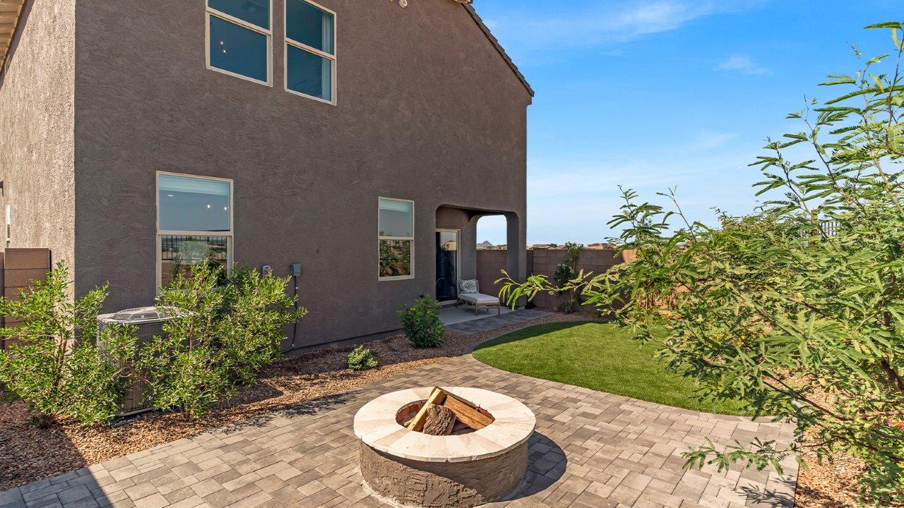 Welcome to The Kate at Coronet at Gladden Farms in Marana, Arizona – a spacious 2,227 sq. ft. two-story home designed to offer both luxury and practicality in a vibrant community setting.  As you step through the welcoming front porch, you’re greeted by an expansive entryway that leads into the heart of the home. The main floor features a generous great room that seamlessly flows into the dining area and kitchen, creating a perfect space for family gatherings and entertaining guests. The kitchen is a chef’s delight with modern appliances and ample storage space.  The main floor also includes a convenient powder room for guests and direct access to the two-car garage, enhancing the home’s functionality.  Upstairs, the primary suite offers a peaceful retreat, complete with a spacious bedroom, a large walk-in closet, and an en-suite bathroom and a walk-in shower. The upper level also includes three additional bedrooms, a full bathroom, and a centrally located utility room for added convenience. A versatile loft area provides additional living space, perfect for a playroom, home office, or secondary lounge.  The Kate in Coronet at Gladden Farms is designed with energy efficiency at its core featuring advanced energy-saving technologies such as a tankless water heater, energy-efficient LED lighting, and high-performance spray foam insulation, helping to lower utility costs.  Living at Coronet at Gladden Farms means more than just having a beautiful home. Residents enjoy access to 830 acres of green space, 28 parks, 19 playgrounds, and exclusive amenities like a sparkling community pool, fitness center, and clubhouse. The gated community also offers walking trails, a dog park, and close proximity to everyday conveniences, making it an ideal environment for families and active lifestyles.