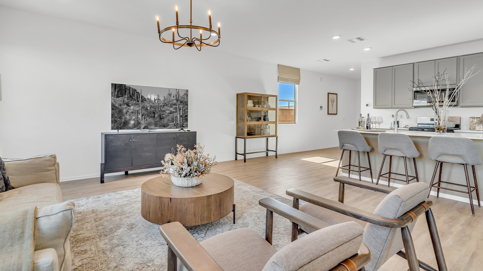 Welcome to The Kate at Coronet at Gladden Farms in Marana, Arizona – a spacious 2,227 sq. ft. two-story home designed to offer both luxury and practicality in a vibrant community setting.  As you step through the welcoming front porch, you’re greeted by an expansive entryway that leads into the heart of the home. The main floor features a generous great room that seamlessly flows into the dining area and kitchen, creating a perfect space for family gatherings and entertaining guests. The kitchen is a chef’s delight, boasting quartz countertops, a large island with a breakfast bar, modern appliances, and a walk-in pantry that provides ample storage.  The main floor also includes a convenient powder room for guests and direct access to the two-car garage, enhancing the home’s functionality. Just off the kitchen and dining room, a covered patio invites you to enjoy the beautiful Arizona weather, offering a serene spot for outdoor dining or relaxation.  Upstairs, the master suite offers a peaceful retreat, complete with a spacious bedroom, a large walk-in closet, and an en-suite bathroom featuring dual vanities and a walk-in shower. The upper level also includes three additional bedrooms, a full bathroom, and a centrally located utility room for added convenience. A versatile loft area provides additional living space, perfect for a playroom, home office, or secondary lounge.  The Kate in Coronet at Gladden Farms is designed with energy efficiency at its core. This DOE Zero Energy Ready Home features advanced energy-saving technologies such as tankless water heaters, energy-efficient LED lighting, and high-performance spray foam insulation, ensuring lower utility costs and a reduced environmental footprint.  Living at Coronet at Gladden Farms means more than just having a beautiful home. Residents enjoy access to 830 acres of green space, 28 parks, 19 playgrounds, and exclusive amenities like a sparkling community pool, fitness center, and clubhouse. The gated community also offers walking trails, a dog park, and close proximity to everyday conveniences, making it an ideal environment for families and active lifestyles.  *Images shown are for reference only. They depict the sales model home and may not represent the actual home.