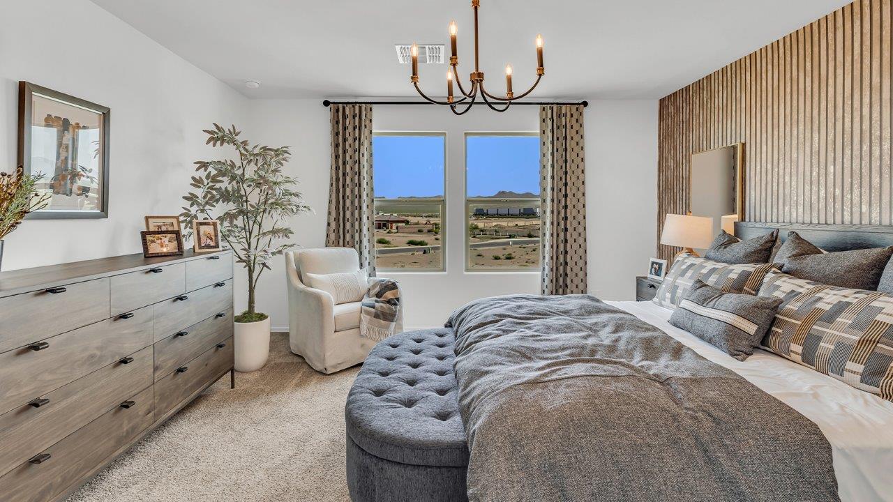 Welcome to The Kate at Coronet at Gladden Farms in Marana, Arizona – a spacious 2,227 sq. ft. two-story home designed to offer both luxury and practicality in a vibrant community setting.  As you step through the welcoming front porch, you’re greeted by an expansive entryway that leads into the heart of the home. The main floor features a generous great room that seamlessly flows into the dining area and kitchen, creating a perfect space for family gatherings and entertaining guests. The kitchen is a chef’s delight, boasting quartz countertops, a large island with a breakfast bar, modern appliances, and a walk-in pantry that provides ample storage.  The main floor also includes a convenient powder room for guests and direct access to the two-car garage, enhancing the home’s functionality. Just off the kitchen and dining room, a covered patio invites you to enjoy the beautiful Arizona weather, offering a serene spot for outdoor dining or relaxation.  Upstairs, the master suite offers a peaceful retreat, complete with a spacious bedroom, a large walk-in closet, and an en-suite bathroom featuring dual vanities and a walk-in shower. The upper level also includes three additional bedrooms, a full bathroom, and a centrally located utility room for added convenience. A versatile loft area provides additional living space, perfect for a playroom, home office, or secondary lounge.  The Kate in Coronet at Gladden Farms is designed with energy efficiency at its core. This DOE Zero Energy Ready Home features advanced energy-saving technologies such as tankless water heaters, energy-efficient LED lighting, and high-performance spray foam insulation, ensuring lower utility costs and a reduced environmental footprint.  Living at Coronet at Gladden Farms means more than just having a beautiful home. Residents enjoy access to 830 acres of green space, 28 parks, 19 playgrounds, and exclusive amenities like a sparkling community pool, fitness center, and clubhouse. The gated community also offers walking trails, a dog park, and close proximity to everyday conveniences, making it an ideal environment for families and active lifestyles.  *Images shown are for reference only. They depict the sales model home and may not represent the actual home.